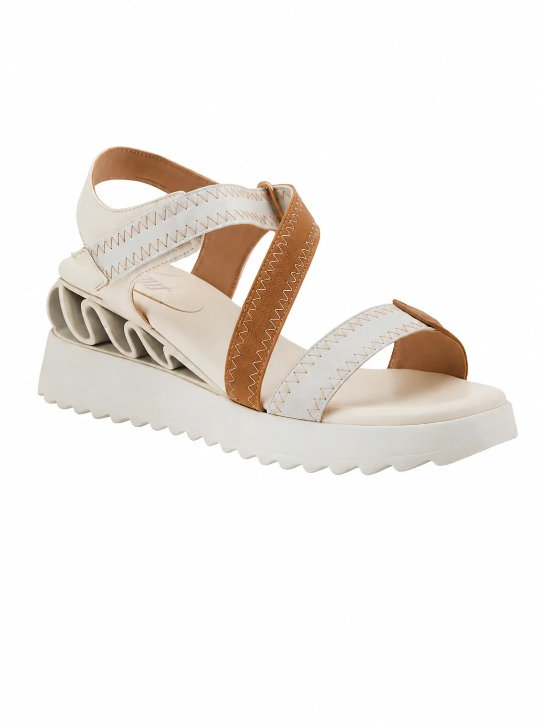 Azura sandal features webbed nylon straps with distinctive zigzag stitching and a sculpted wave-cushioned wedge heel