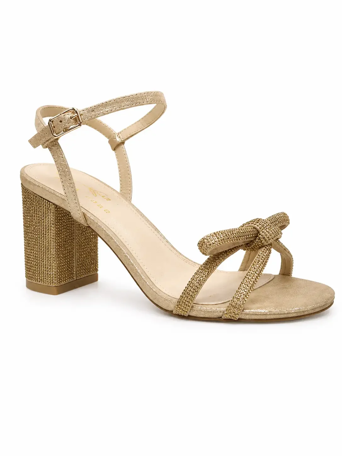 Jildor Chrissy Sandal Gold features a metallic gold finish and a statement bow adorned with rhinestones