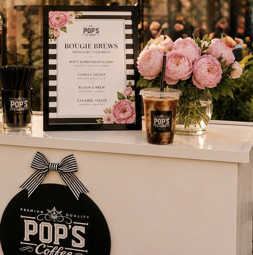 Beautifully styled coffee cart featuring signature cold brews and custom menu signage by Pop's Premium Coffee.