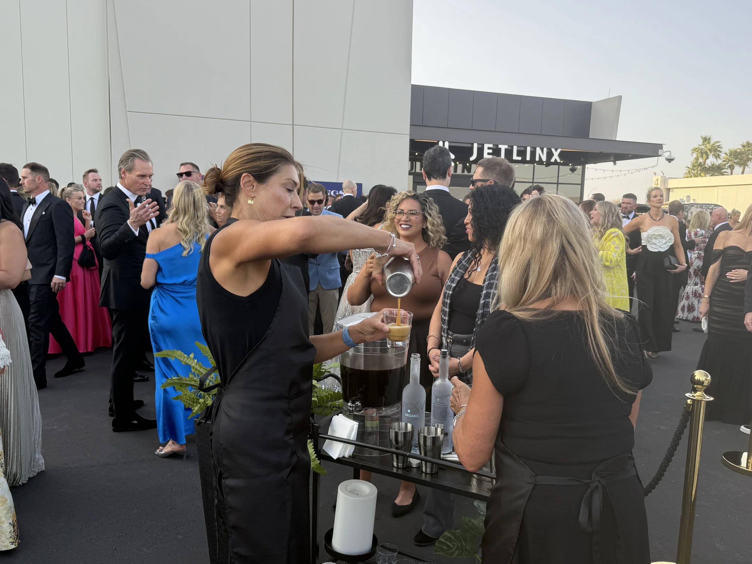 Pop's Premium Coffee serving specialty coffee beverages to guests at a luxury corporate event.