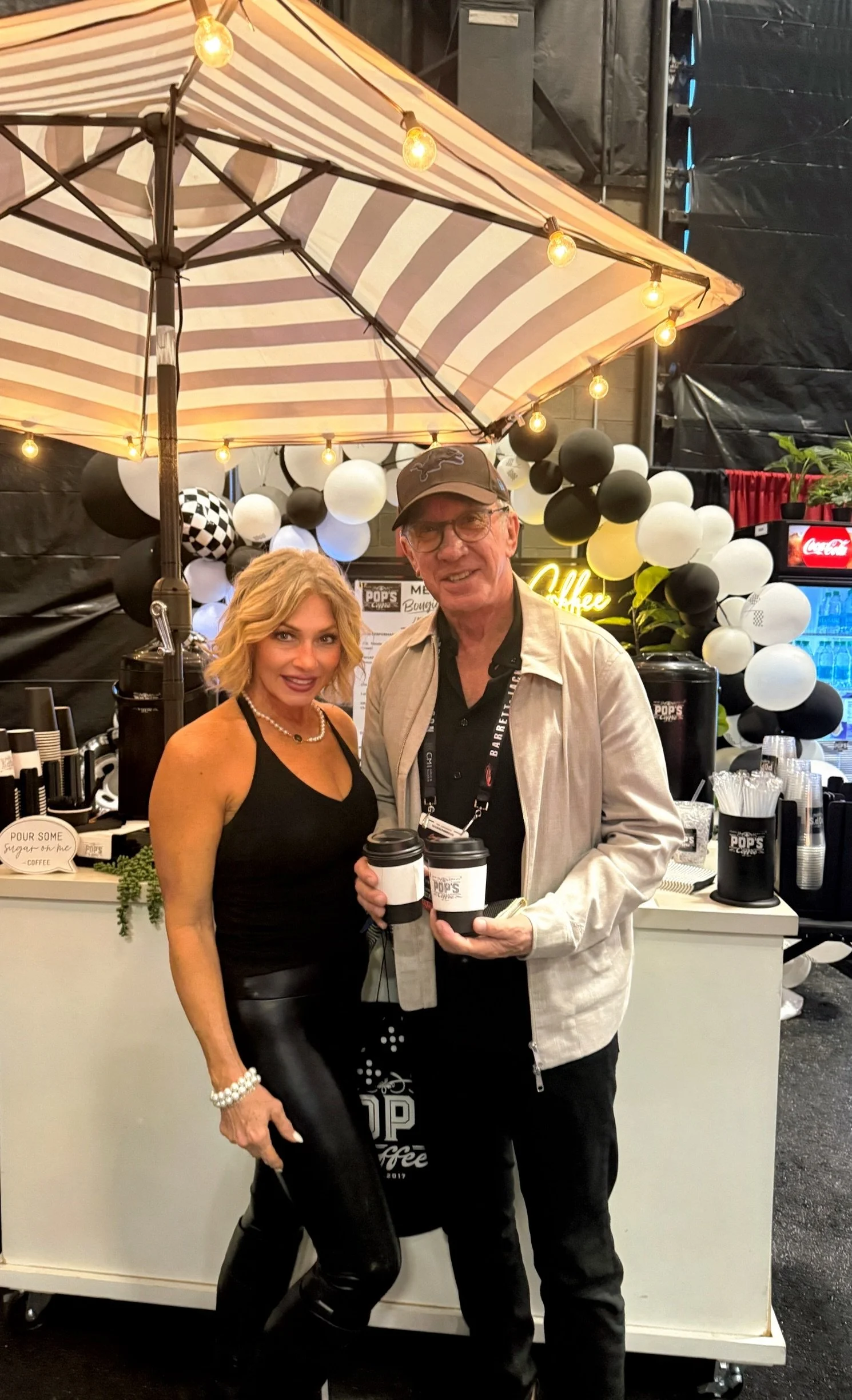 Guest enjoying coffee at the Pop's Premium Coffee cart during the Barrett-Jackson Scottsdale auction,