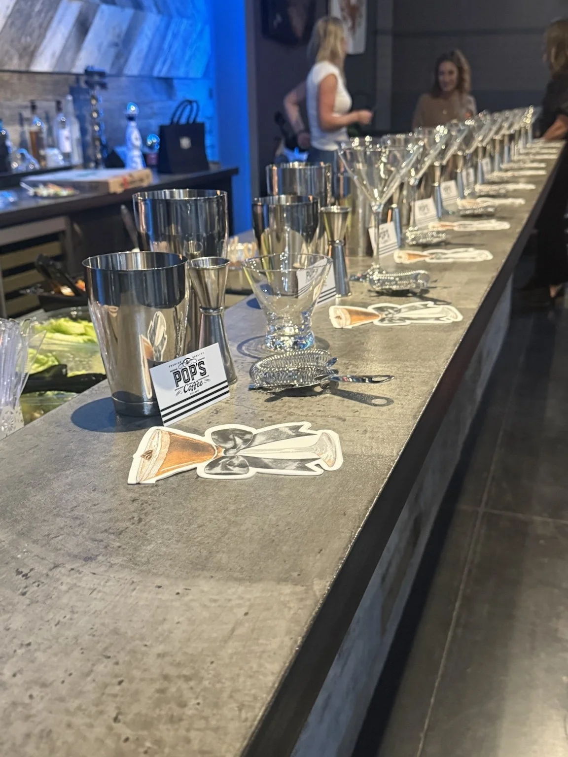 Premium espresso martini setup by Pop's Premium Coffee featuring elegant glassware, bar tools, and cocktail garnishes for luxury private events and interactive espresso martini classes.