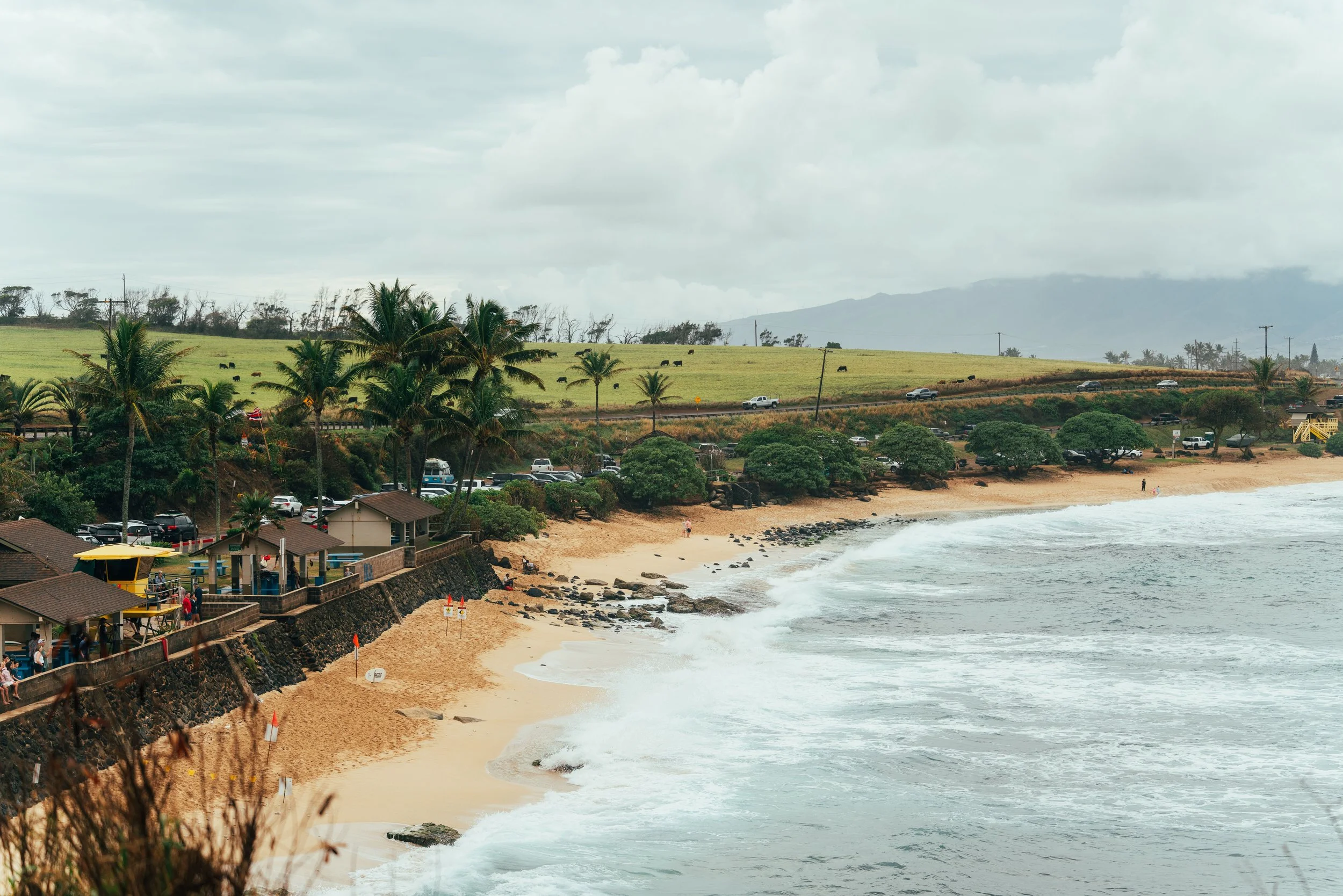 Surfers at Ho'okipa Beach, a windsurfing and surf spot on Maui's North Shore