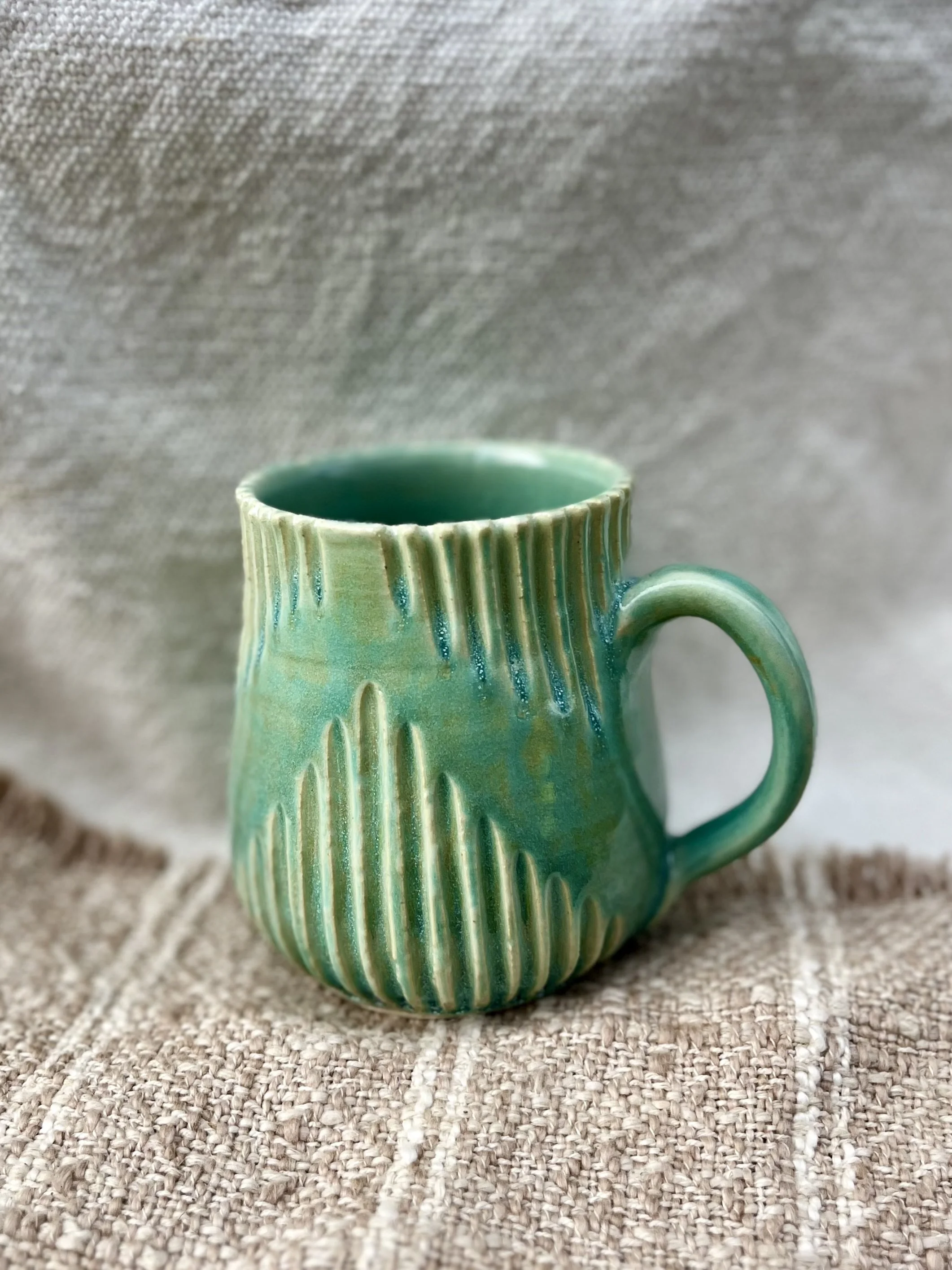 Turquoise carved mug