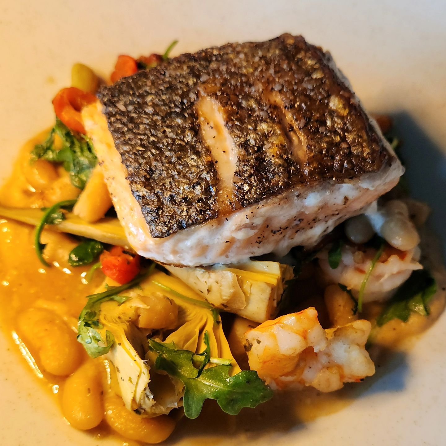 Lots of new spring menu items to try! Seared Faroe Island Salmon with NC shrimp is just one of our new dinner items. Check out all of our updated menus through the link in our bio then join us Tuesday - Sunday to find your new favorite! 
.
.
#seafood