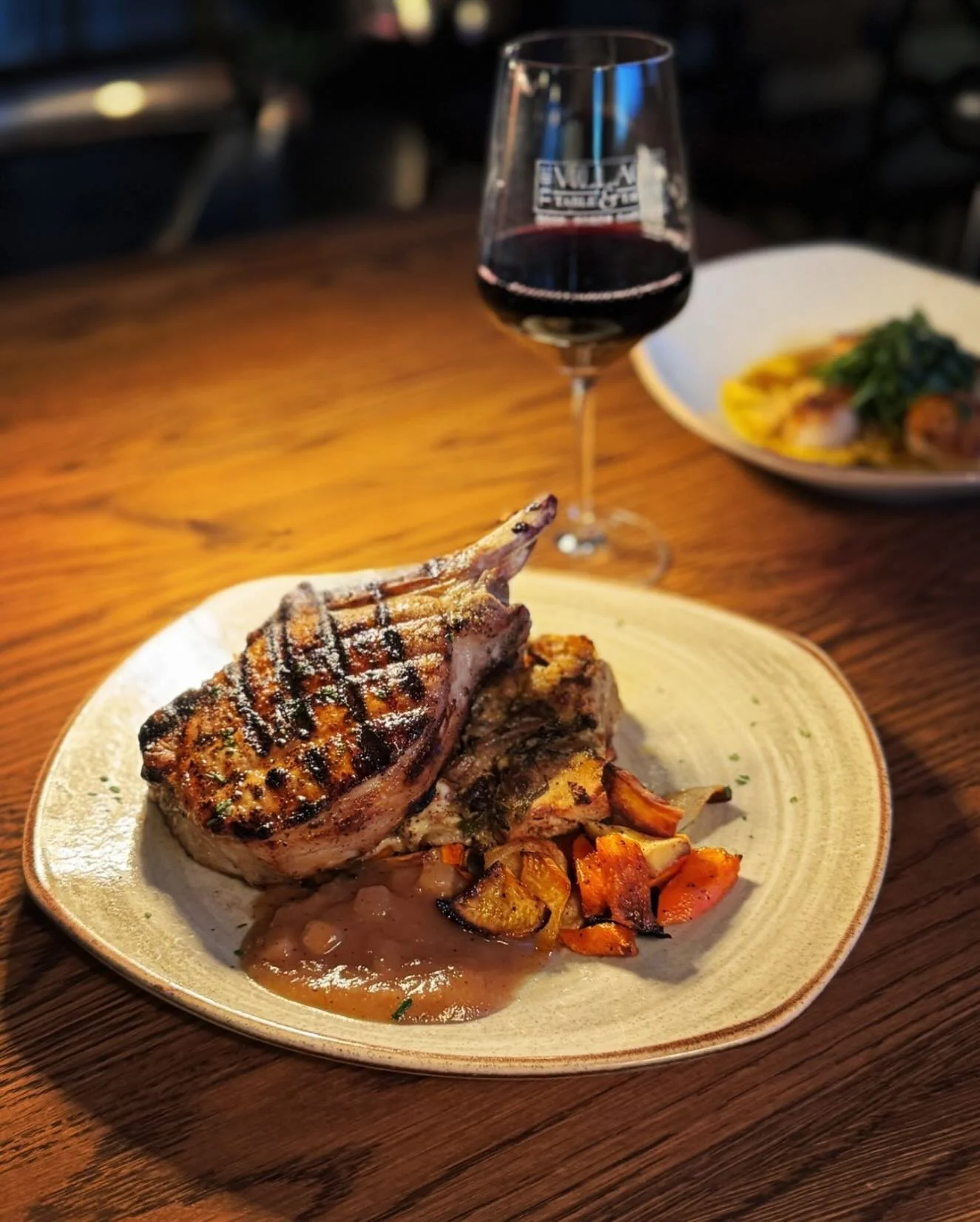🍂 Fall nights call for this beauty: our Grilled Double Bone Duroc Pork Chop
&bull;
Juicy, heritage-breed Duroc pork chop grilled to perfection, served with savory wild mushroom &amp; thyme bread pudding (think stuffing&rsquo;s elegant cousin), a col