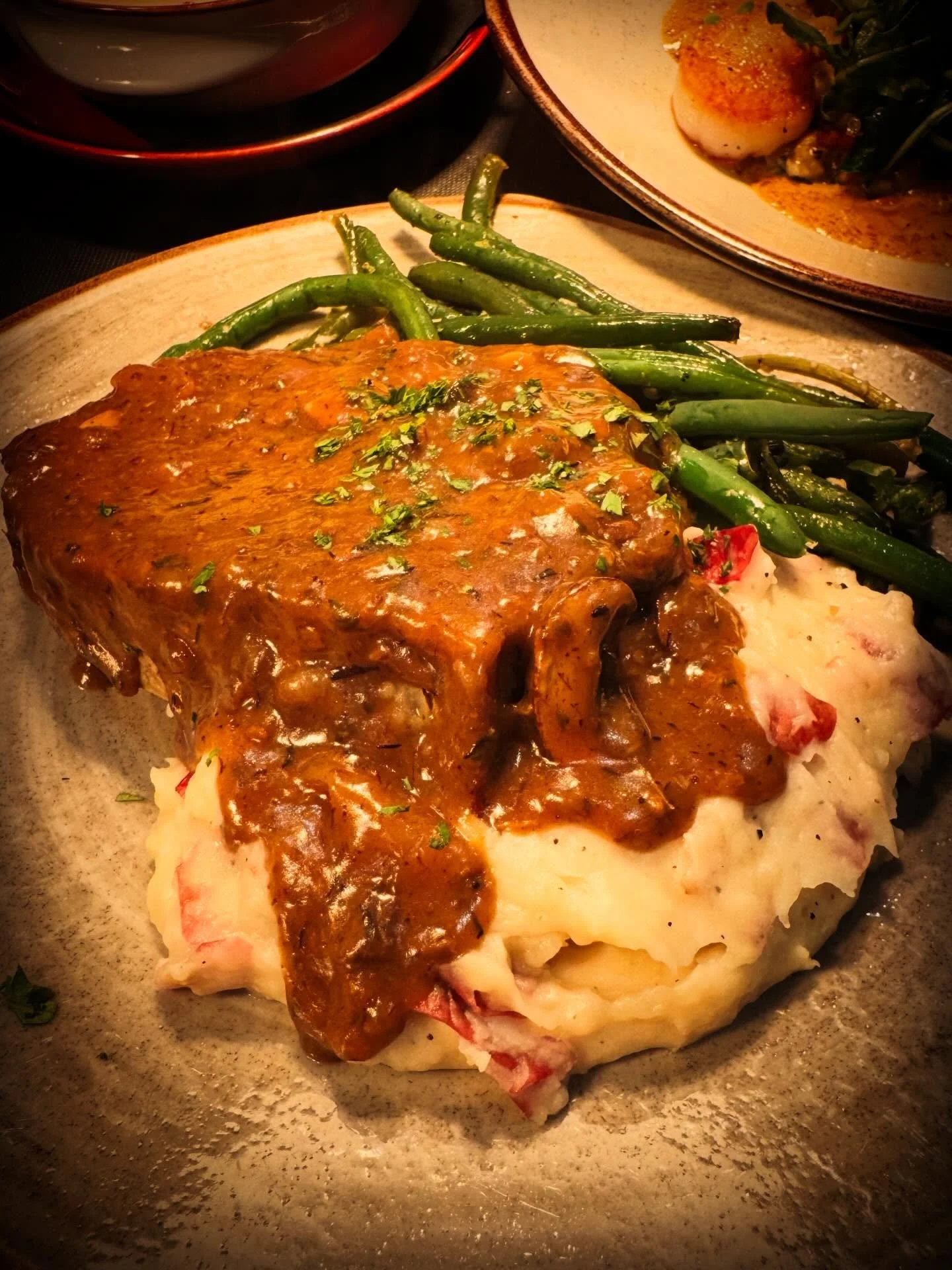 Nothing beats cozying up with classic comfort food that&rsquo;s been given a delicious, inspired twist. Our signature wild boar meatloaf smothered in rich mushroom gravy is the ultimate hug on a plate &ndash; hearty, flavorful, and perfect for chasin