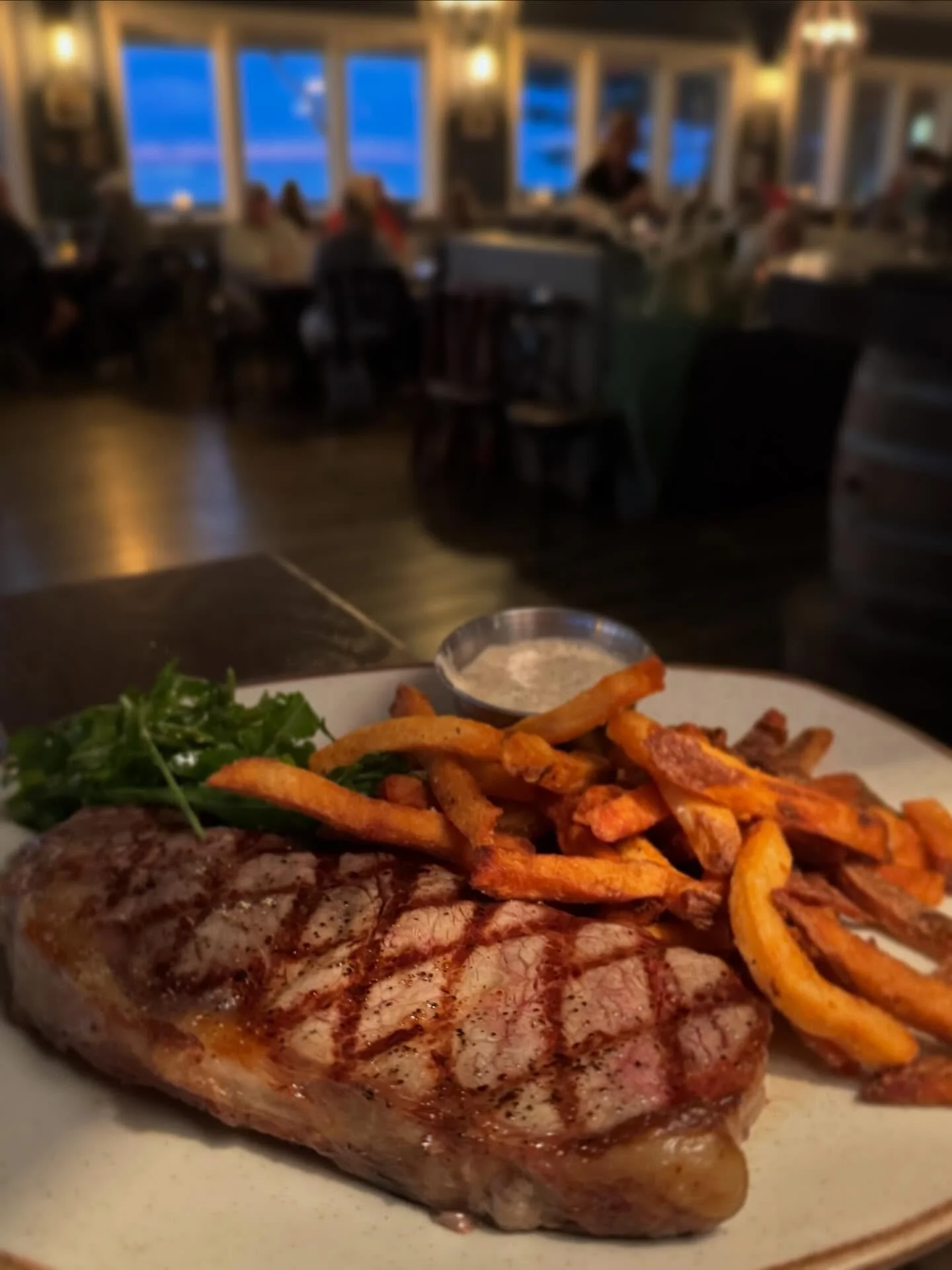 Sometimes all it takes to melt away those winter blues is a juicy, perfectly seared steak, golden, crispy tallow fries, and a view of the  sun sinking over the water. Grab it all at The Village - your waterfront dinner destination in Duck.
&bull;
#ob