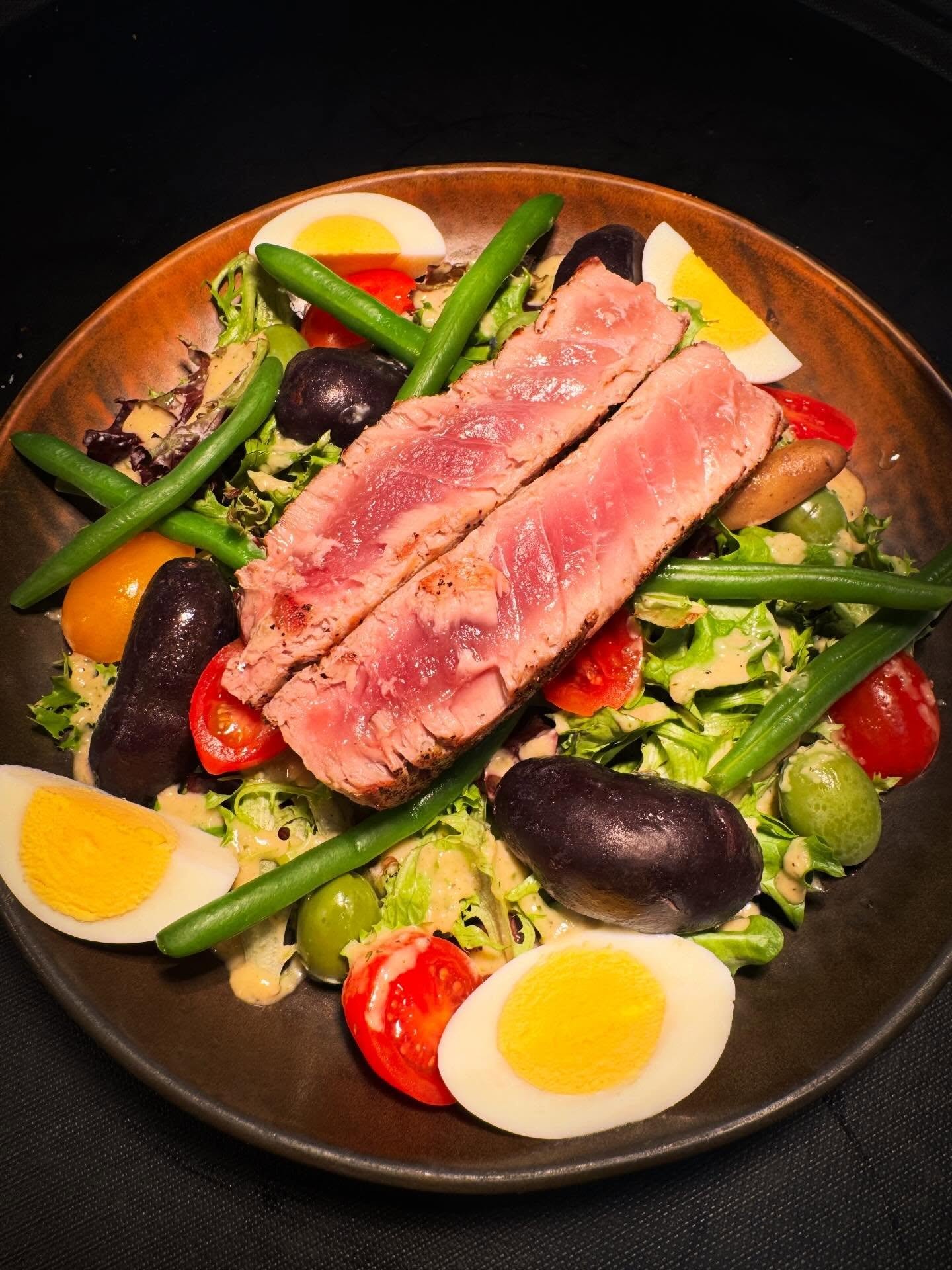 Sometimes you just crave the comfort of a classic. Our Ni&ccedil;oise salad has been a beloved Village favorite since day one: perfectly seared fresh tuna cooked to your liking, crisp vegetables, and our signature house-made dressing. Timeless, vibra