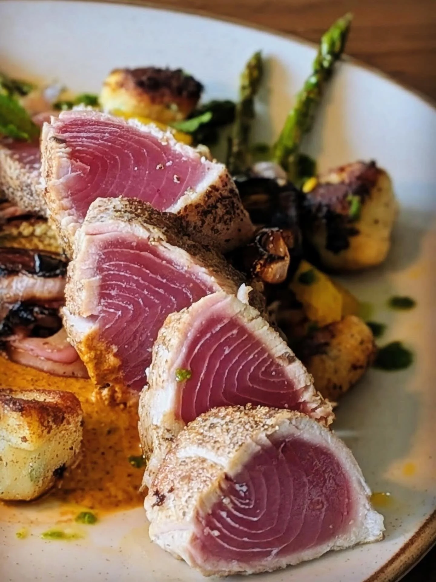 Gorgeous entr&eacute;e special coming out of the kitchen this evening: seared yellowfin Tuna, roasted garlic gnocchi, grilled eggplant, asparagus, peppers, and onion with charred pepper harissa sauce and saffron pickled fennel. Get it while it lasts!