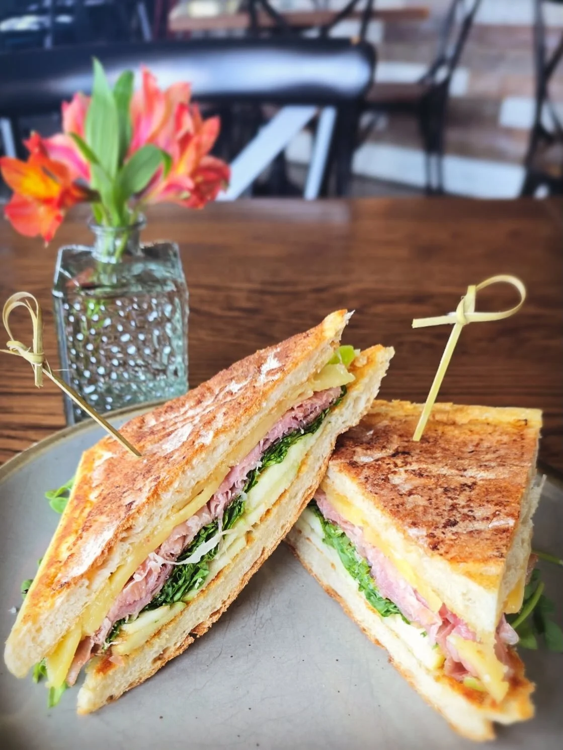 Just a reminder that this spring The Village is open for lunch Monday-Saturday! Join us today to snag this special sandwich: Serrano ham, Mahon cheese, Granny Smith apples, arugula, and balsamic pressed in ciabatta. 
&bull;
#obxlunch #ducknclunch #lu
