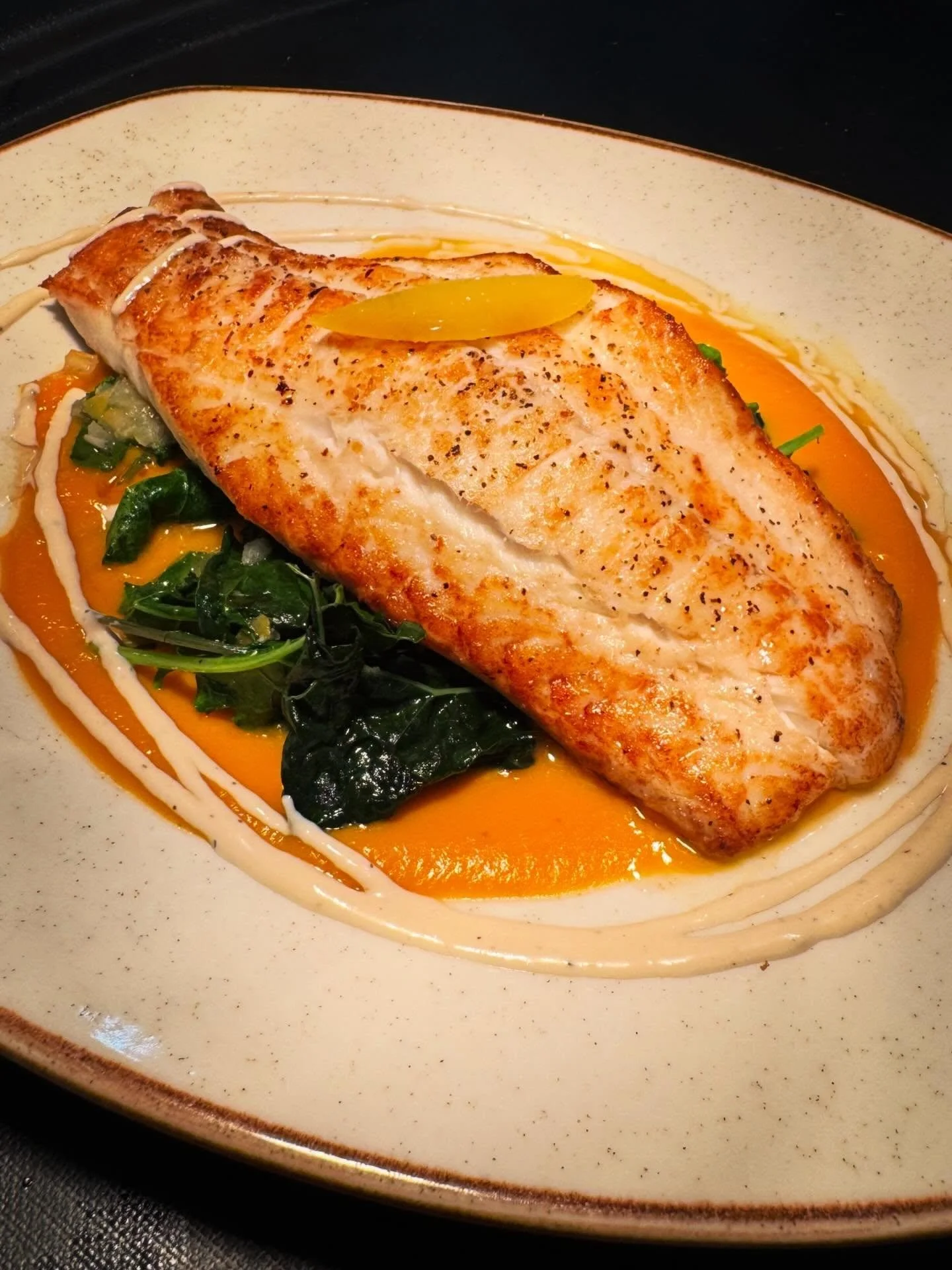 The Village spring dinner menu delivers on seafood favorites. Our seared sea scallops with wild mushroom risotto, wilted arugula, and a Serrano ham-saffron cream is made extra special with a sprinkling of crispy Serrano ham. Chef&rsquo;s seasonal cat