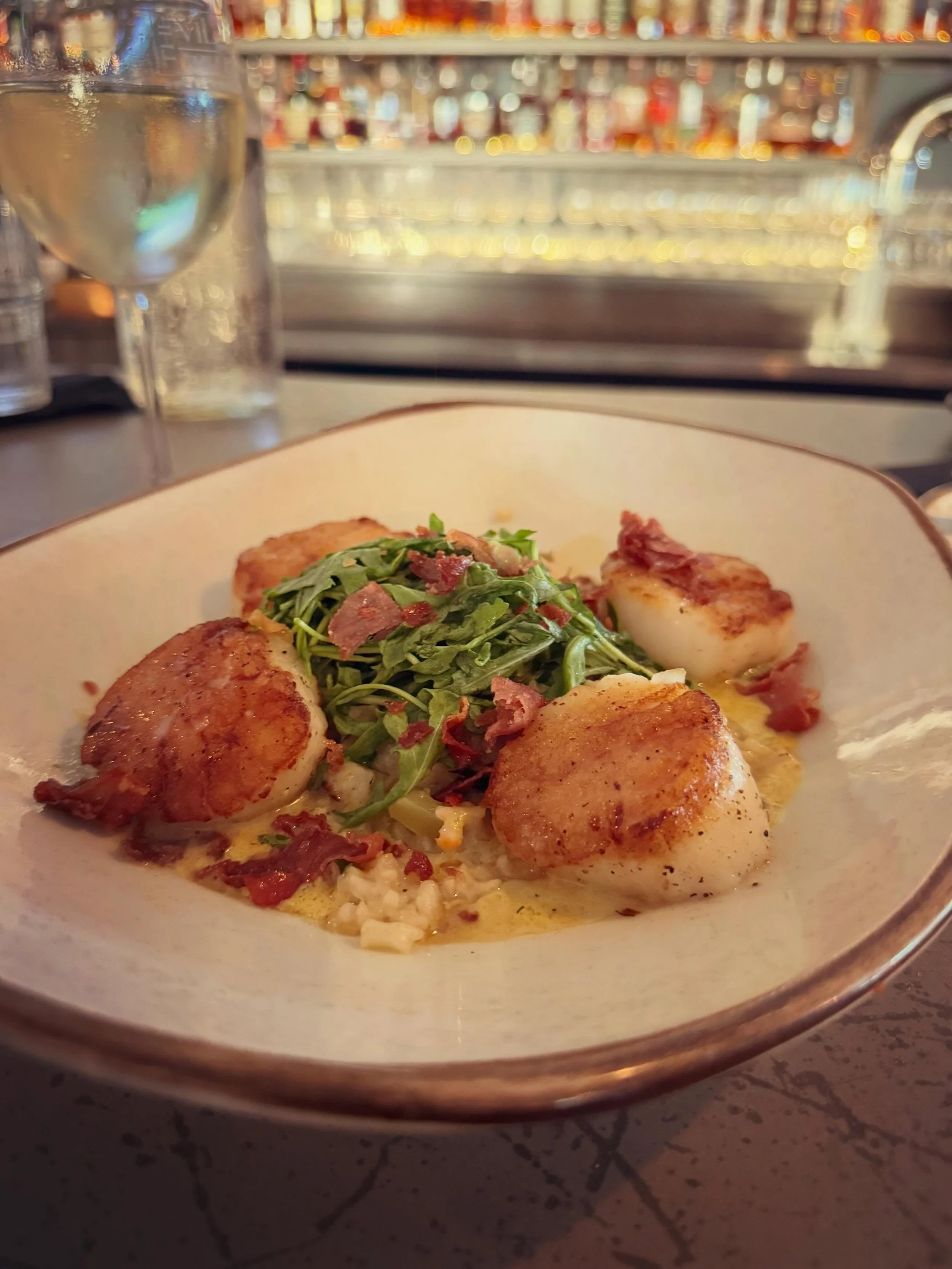 Join us for dinner and discover Chef Mike Thomas&rsquo;s fresh takes on classic dishes like this spring menu favorite: Succulent scallops meet creamy risotto and a vibrant Serrano-saffron sauce for an unforgettable dish. 
&bull;
#springmenu #seascall