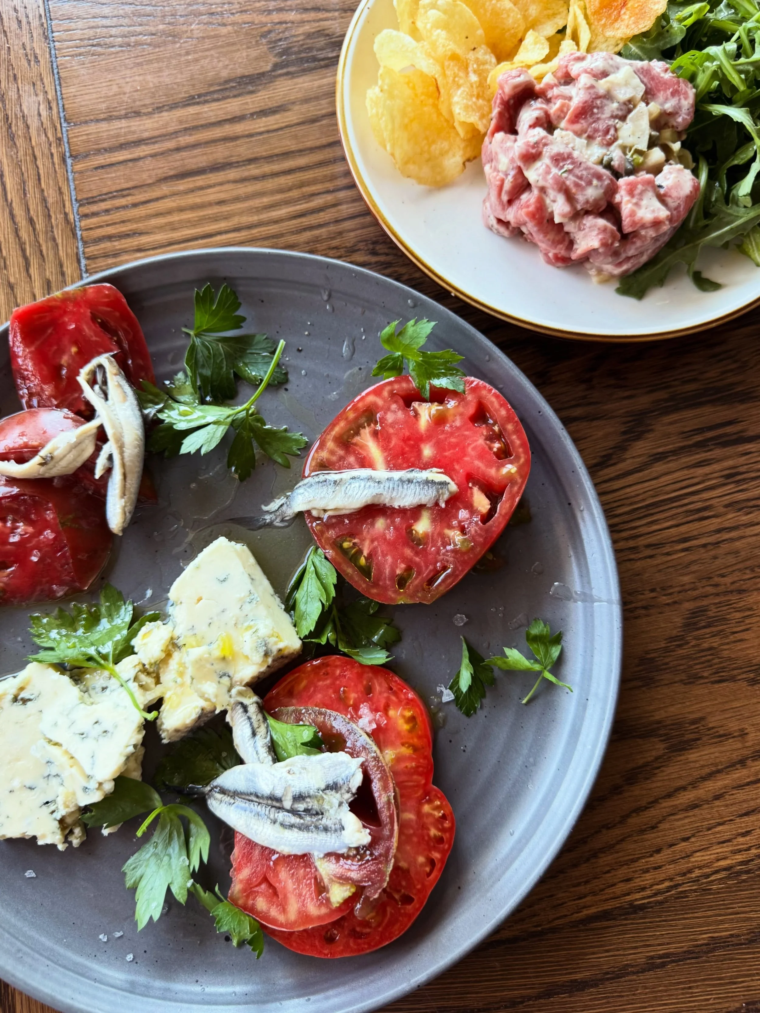 Discover tonight&rsquo;s refreshing starter specials at The Village! First up: a vibrant heirloom tomato starter bursting with peak-summer flavor&mdash;juicy, perfectly ripe tomatoes paired with the creamy smokiness of Rogue River Smokey Blue and bri
