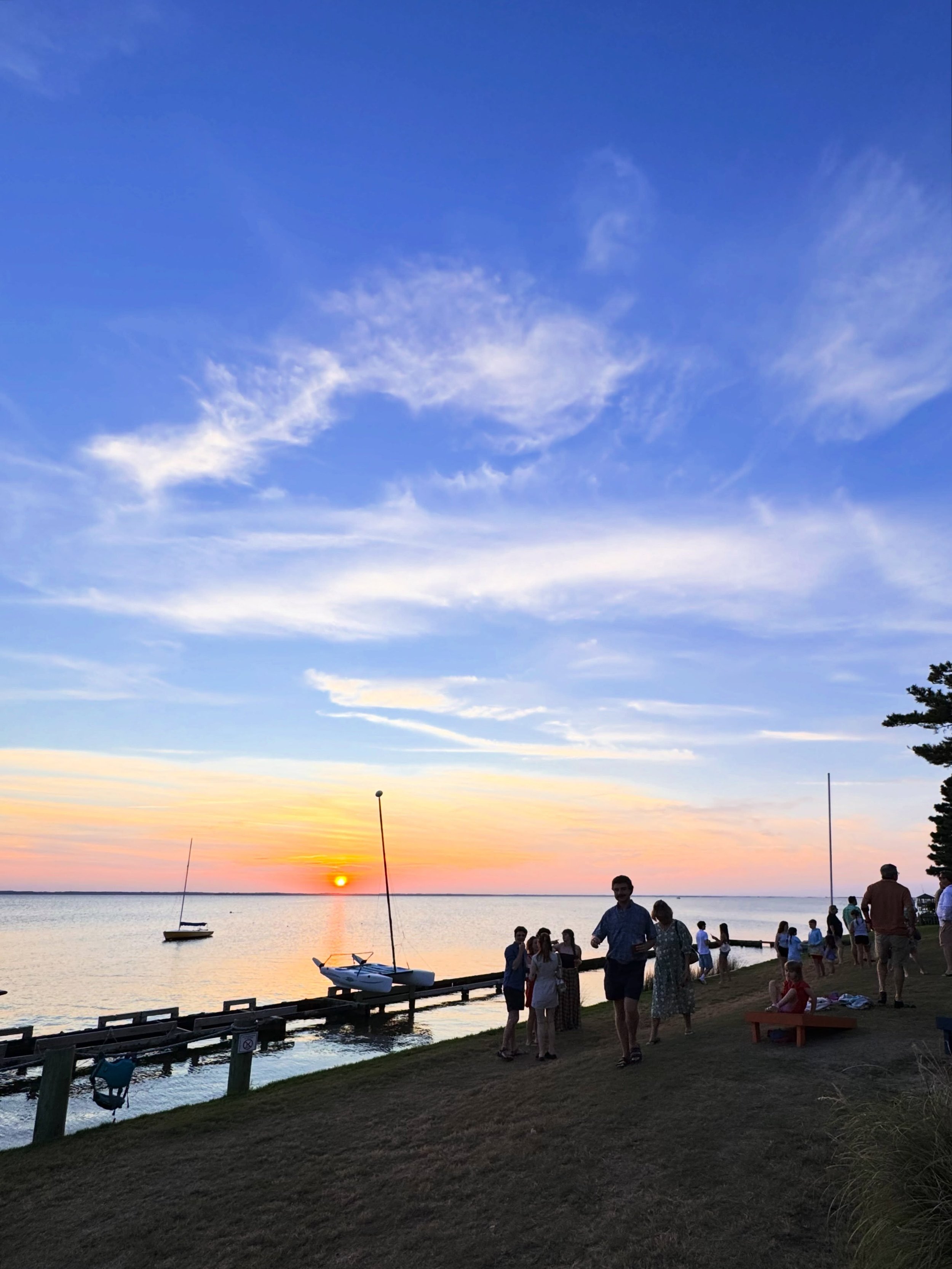 A waterfront sunset deserves a spot on your OBX bucket list. Catch yours at The Village Table &amp; Tavern in Duck. Get dinner upstairs on the deck, in the dining room, and at the bar. Enjoy drinks, snacks, and live music in our outdoor Sound Lounge.