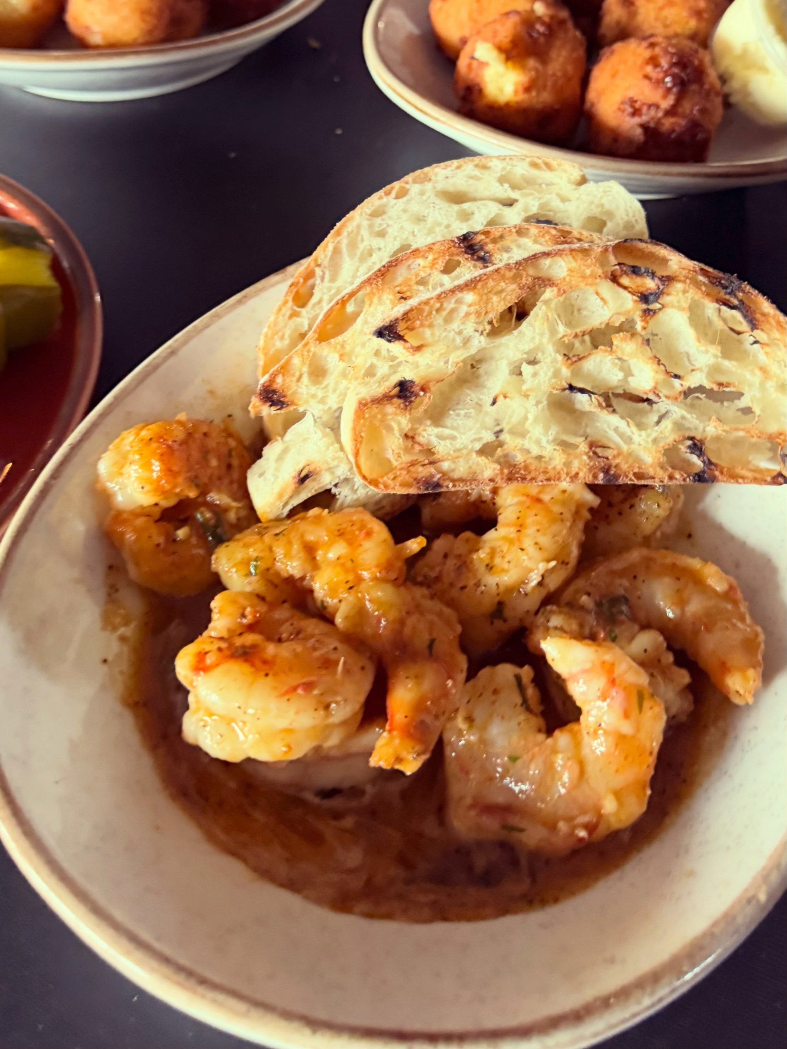Starting dinner right with our Spanish style garlic shrimp. And those goat cheese &amp; feta hushpuppies are a solid pick, too. See all the options through the link in our bio. 
&bull;
#dinner #appetizers #dinnerwithaview #ducknc #obxrestaurant