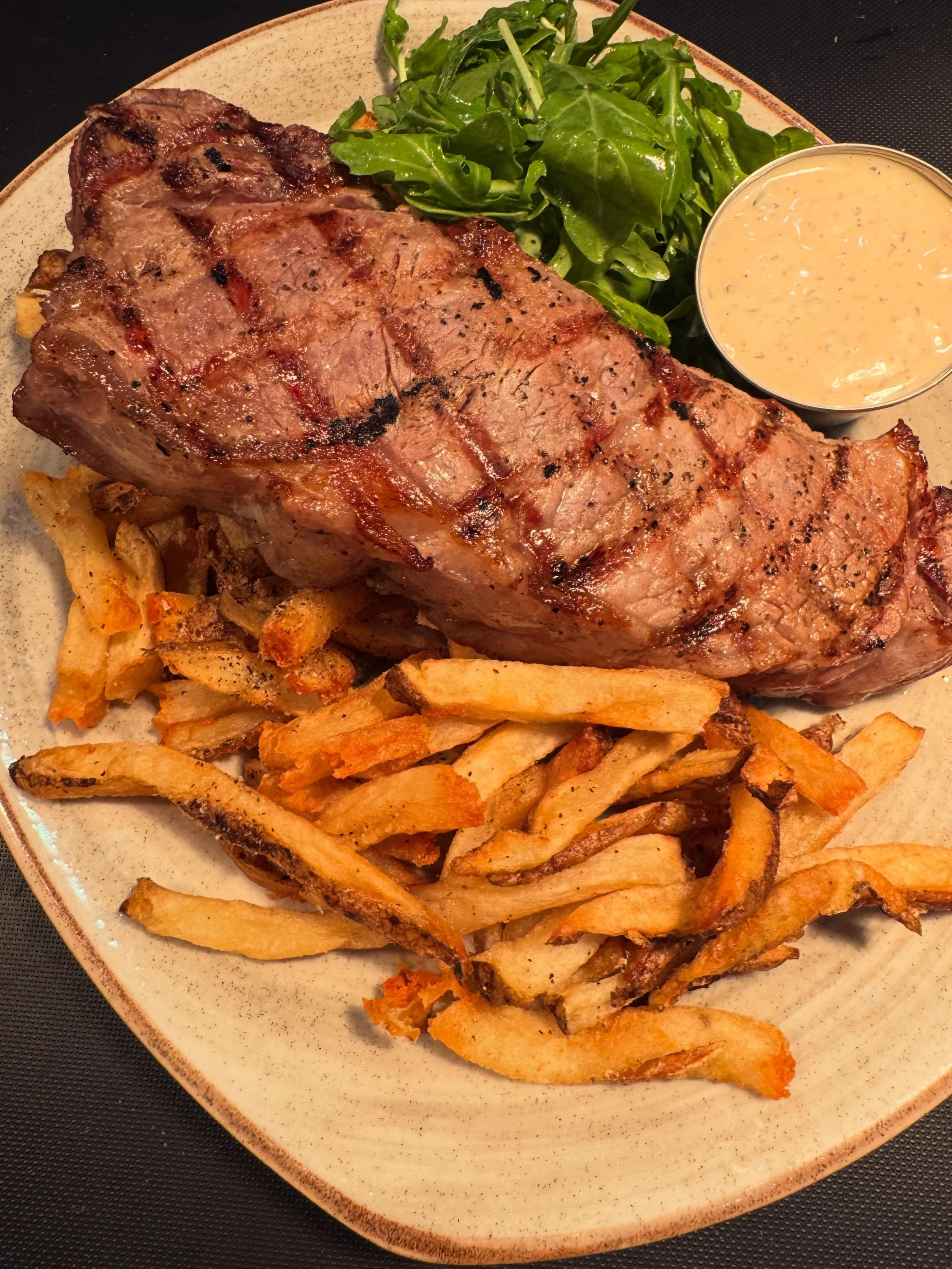 Elevated yet simple tavern fare at its finest: Grilled NY strip and perfectly crispy beef tallow fries with a b&eacute;arnaise aioli for dipping. &bull;
&bull;
The Village is open for dinner Monday-Friday from 4-8:30. See our full menu online through