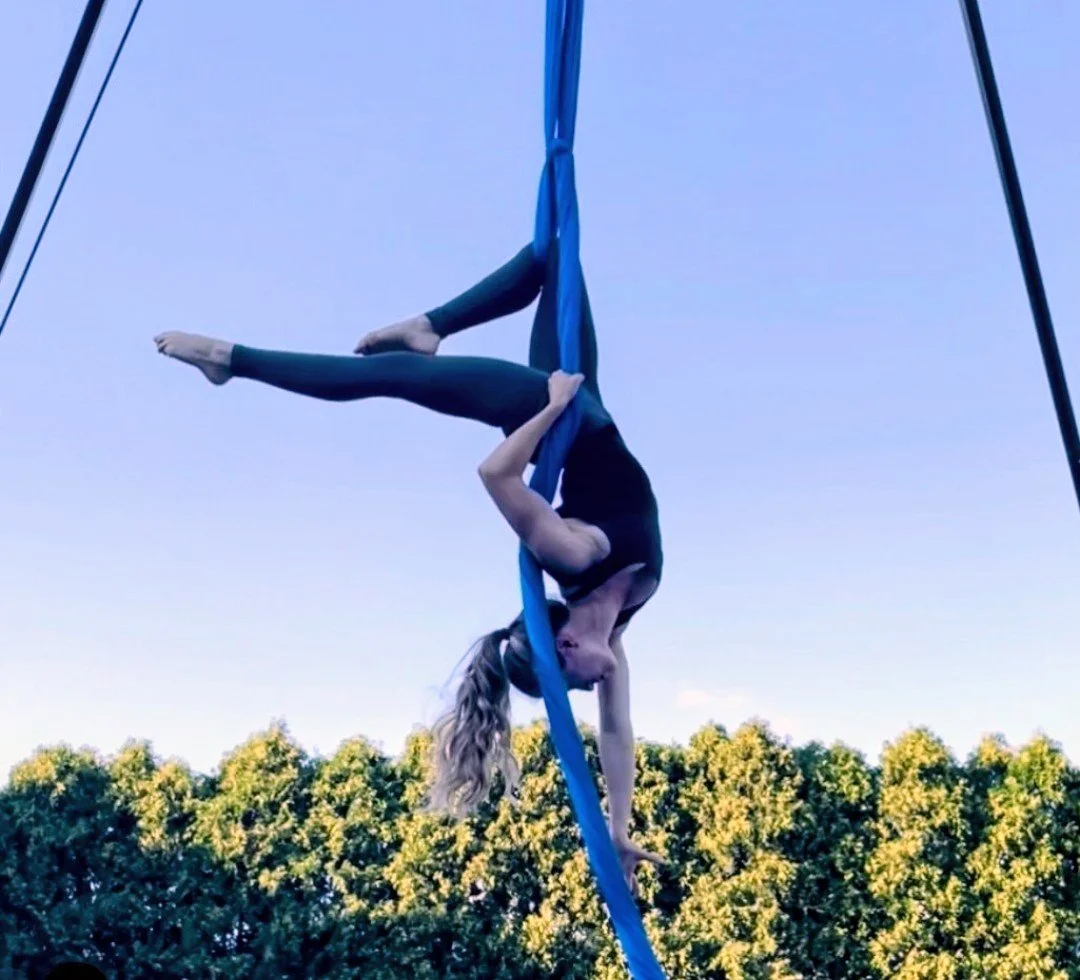 woman on blue aerial silks
