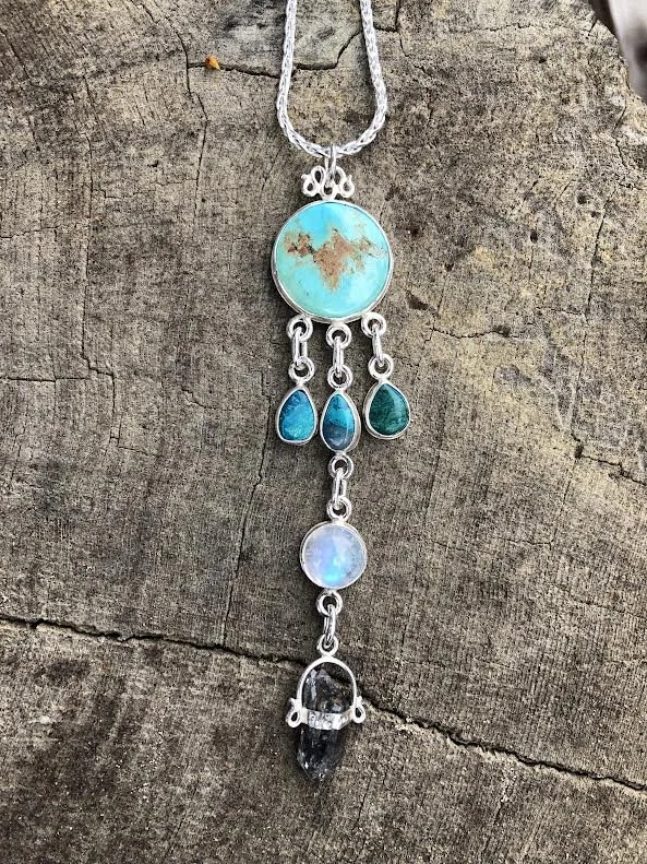 Silver pendant necklace with turquoise, opal, and black carbon herkamir diamond.  Custom amulets for power and protection for your unique energy system. Shen ring healing arts