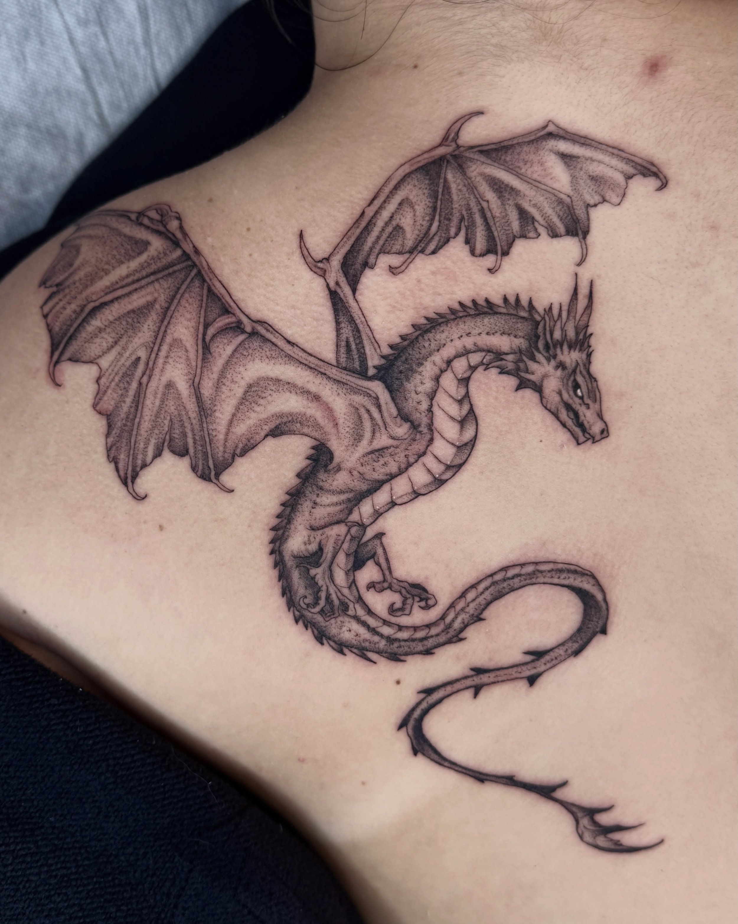 a dragon on her back, a second one coming next month. Swipe for ✍️ 

Thanks again Kaylee!

#finelinetattoos #dragontattoo #savannahtattooartist #savannahga #blackworktattoos