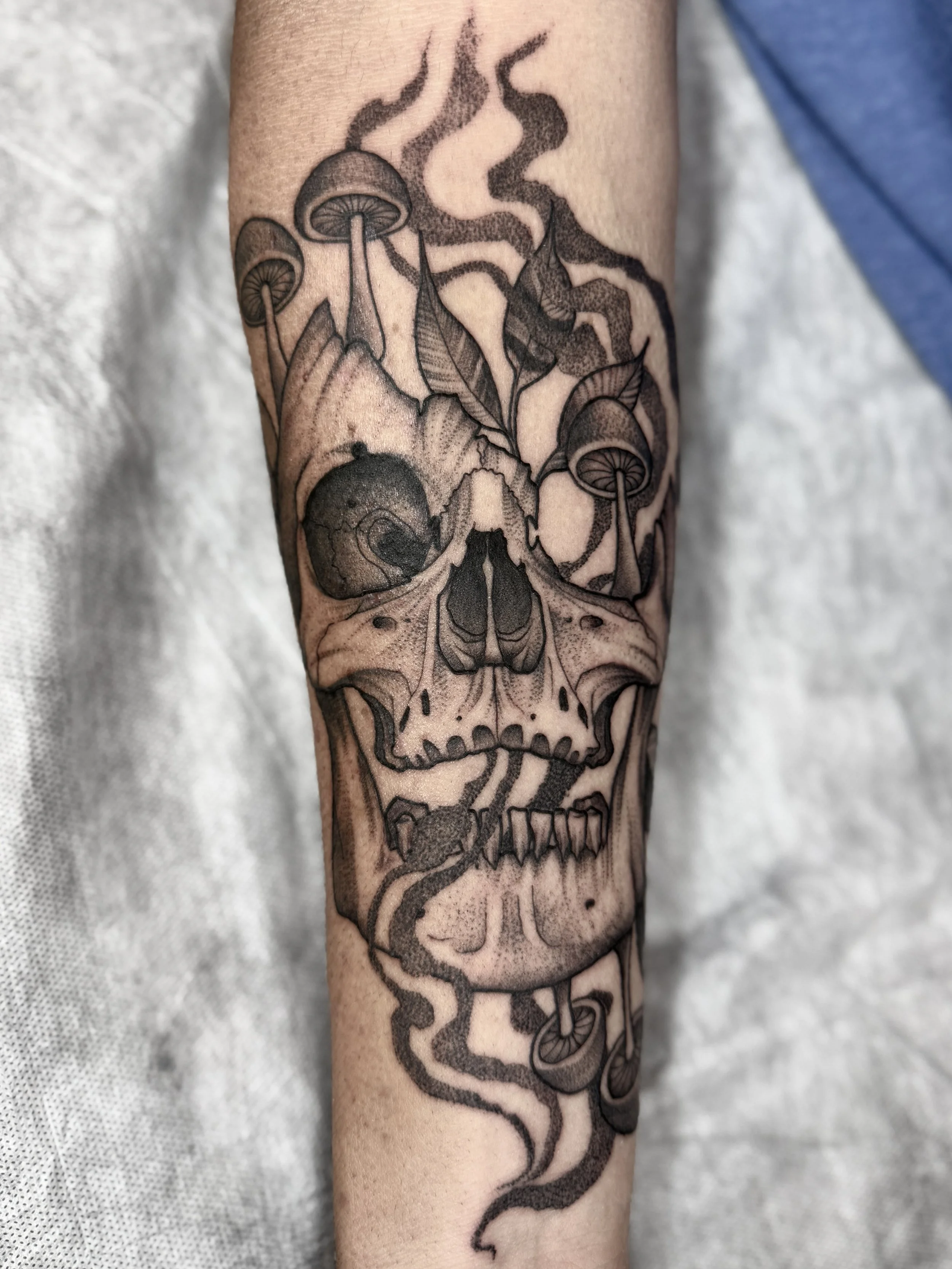 smoky shroomy skull tattoo