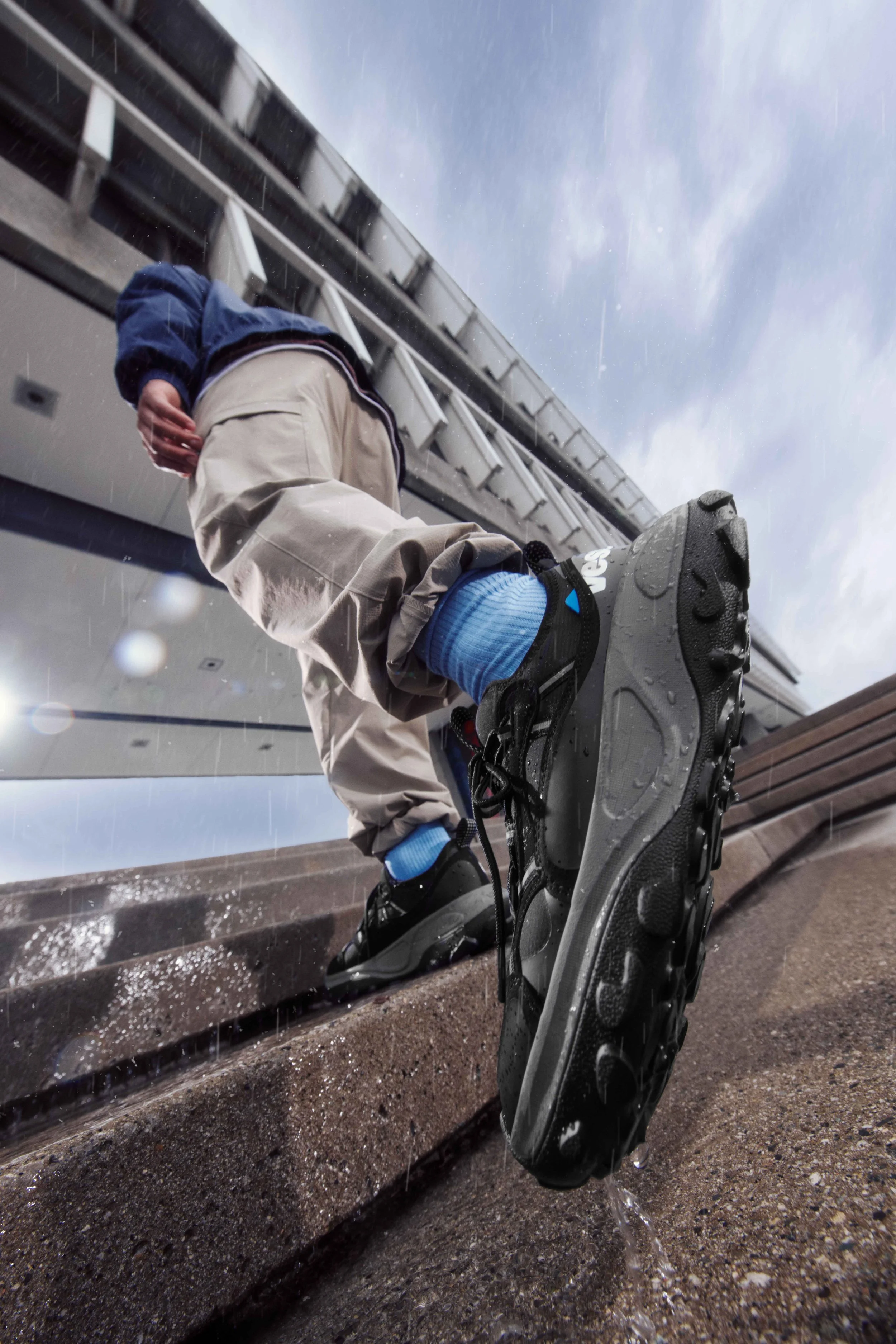 mist-jacket-blue-with-motu-sneaker-male-model-stairs-2.jpg