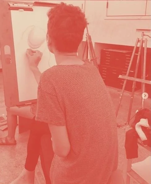 Rear view of a student in drawing class