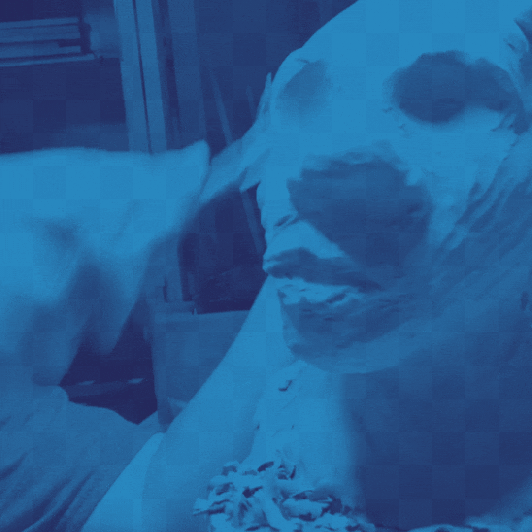 Motion view of April Terra Livingston creating a sculpture with clay