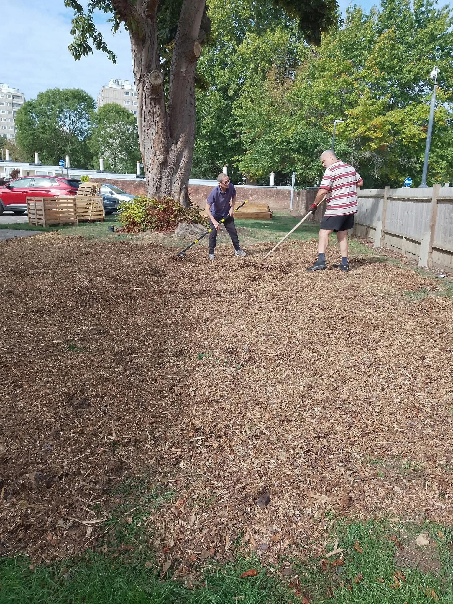 Greg from the Community Shed doing his bit for the garden with Phil