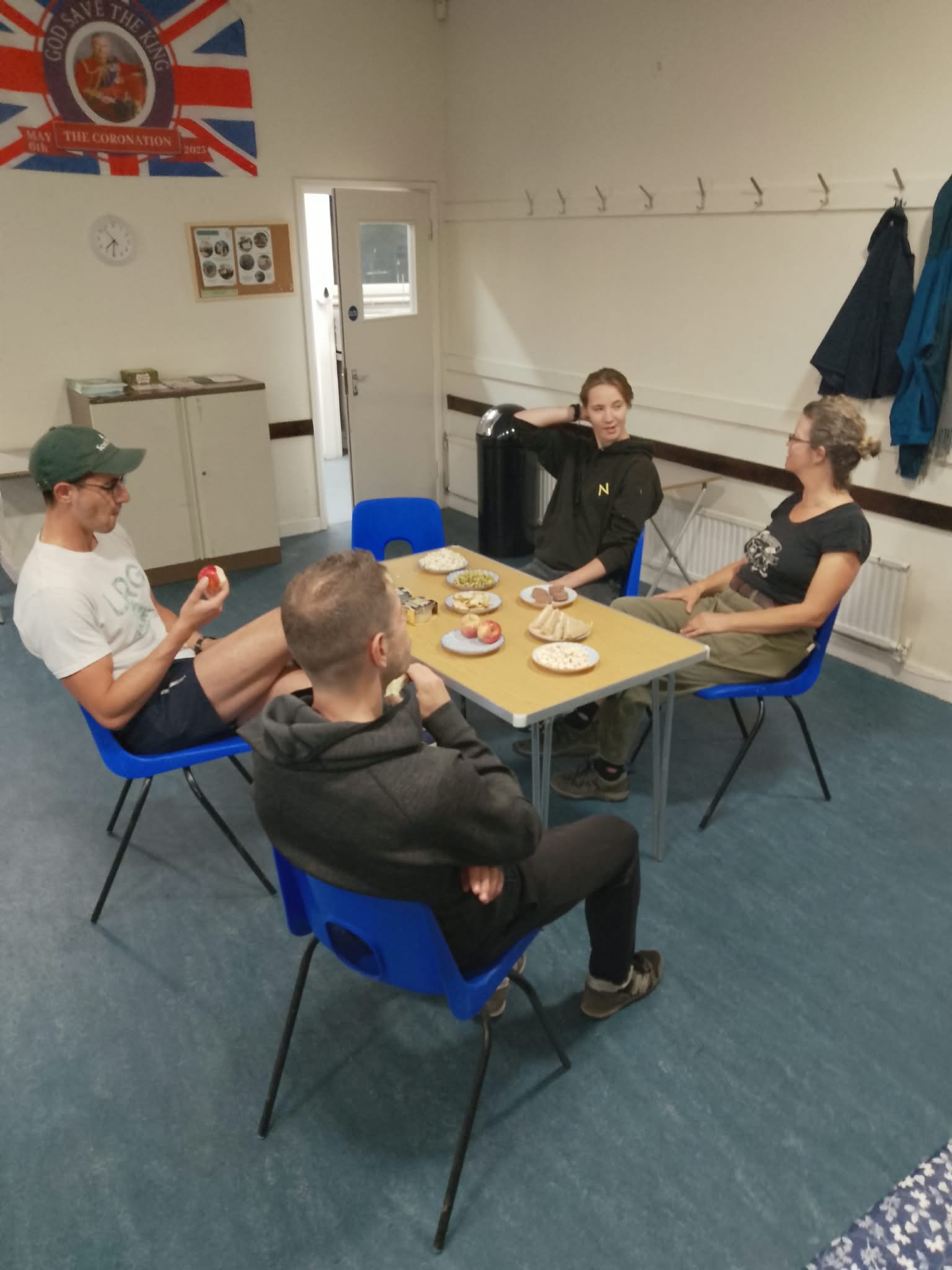 taking a minute to enjoy some refreshments after completing the planters and compost bays 