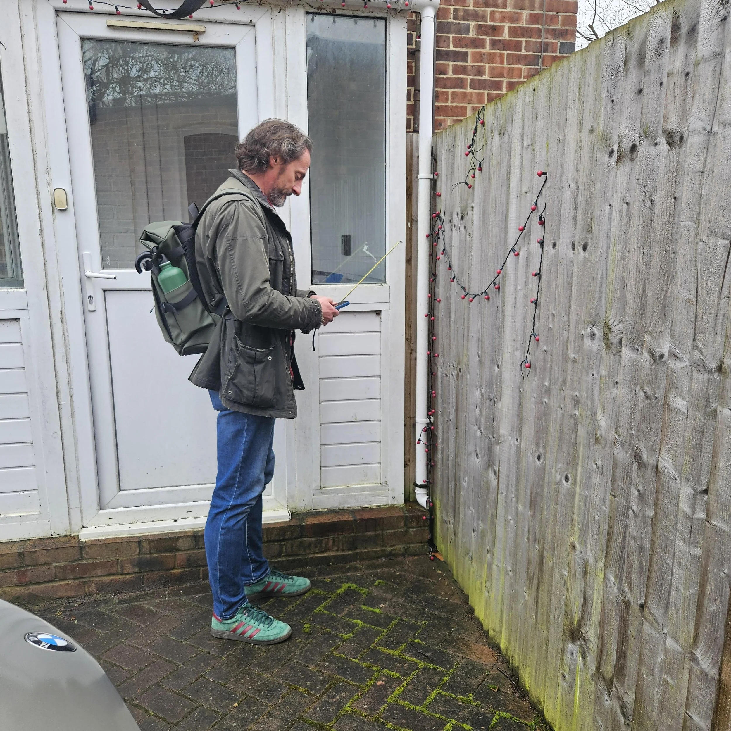 Nick measuring up for rainwater collection butts