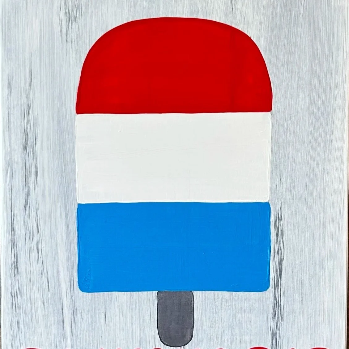 Painting of a popsicle with red, white, and blue stripes on a light gray wooden background.