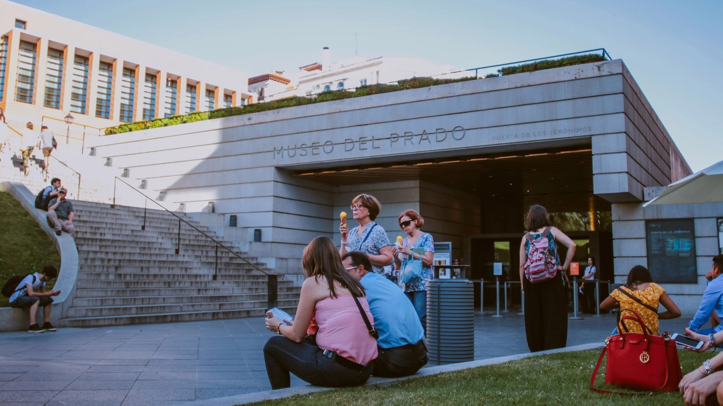 People eating ice cream outside a museum