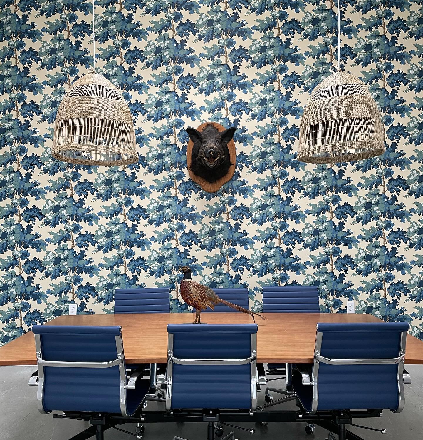 A conference room designed by @erikakludwig for the new location of Sidecar studios staring Sandburg Raphael wallpaper, a vintage Herman Miller conference table and of course the boars head from old Sidecar to preside over everything!

#sandbergwallp