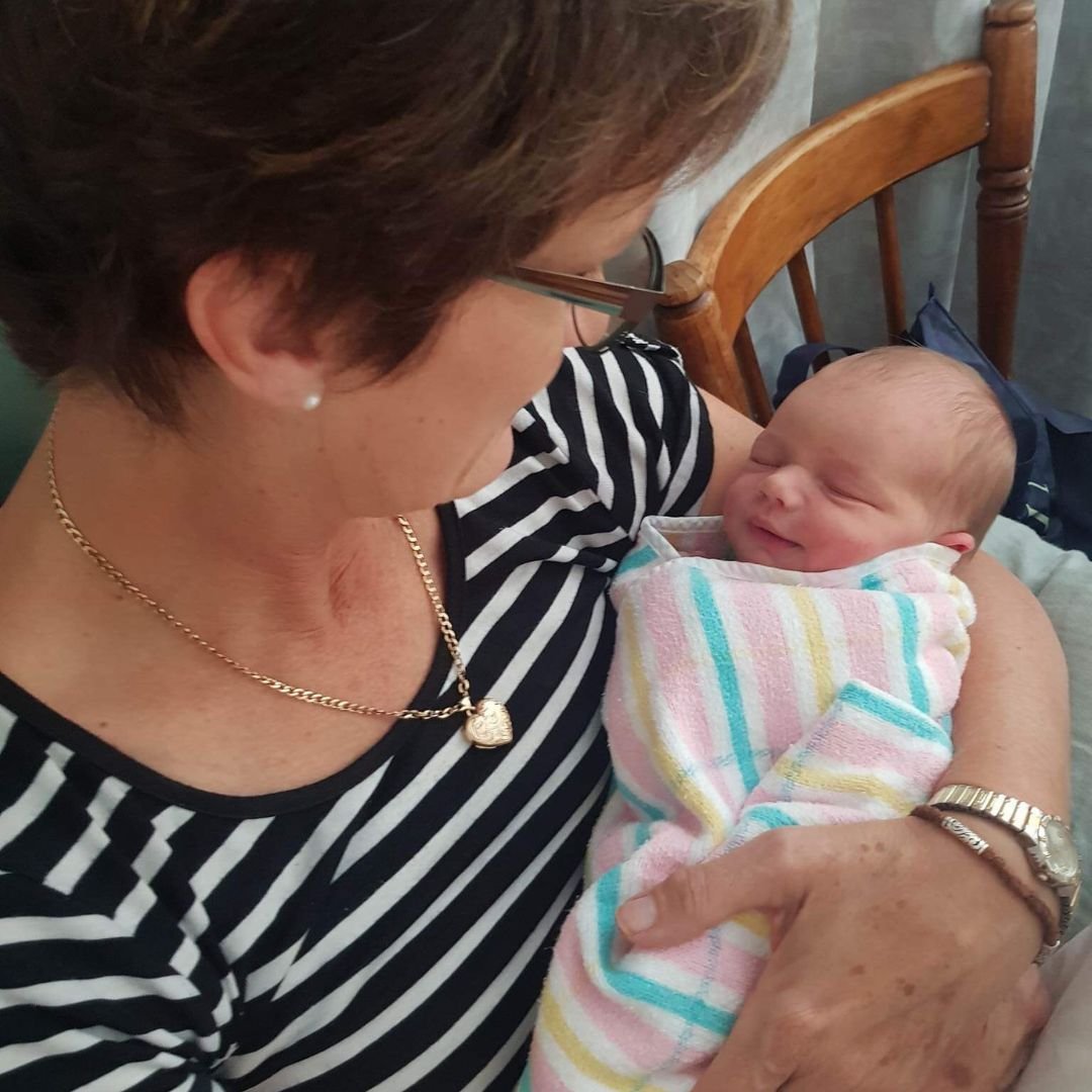 Meg Gillespie holds her first grand daughter, Macey Blaise, in her arms for the first time.