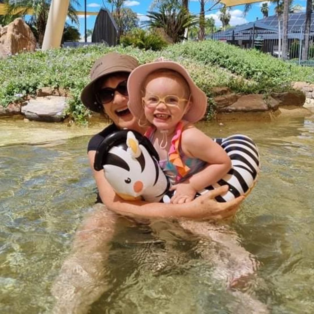 Meg and her grand daughter, now 3 years old, having fun playing in the wading pool