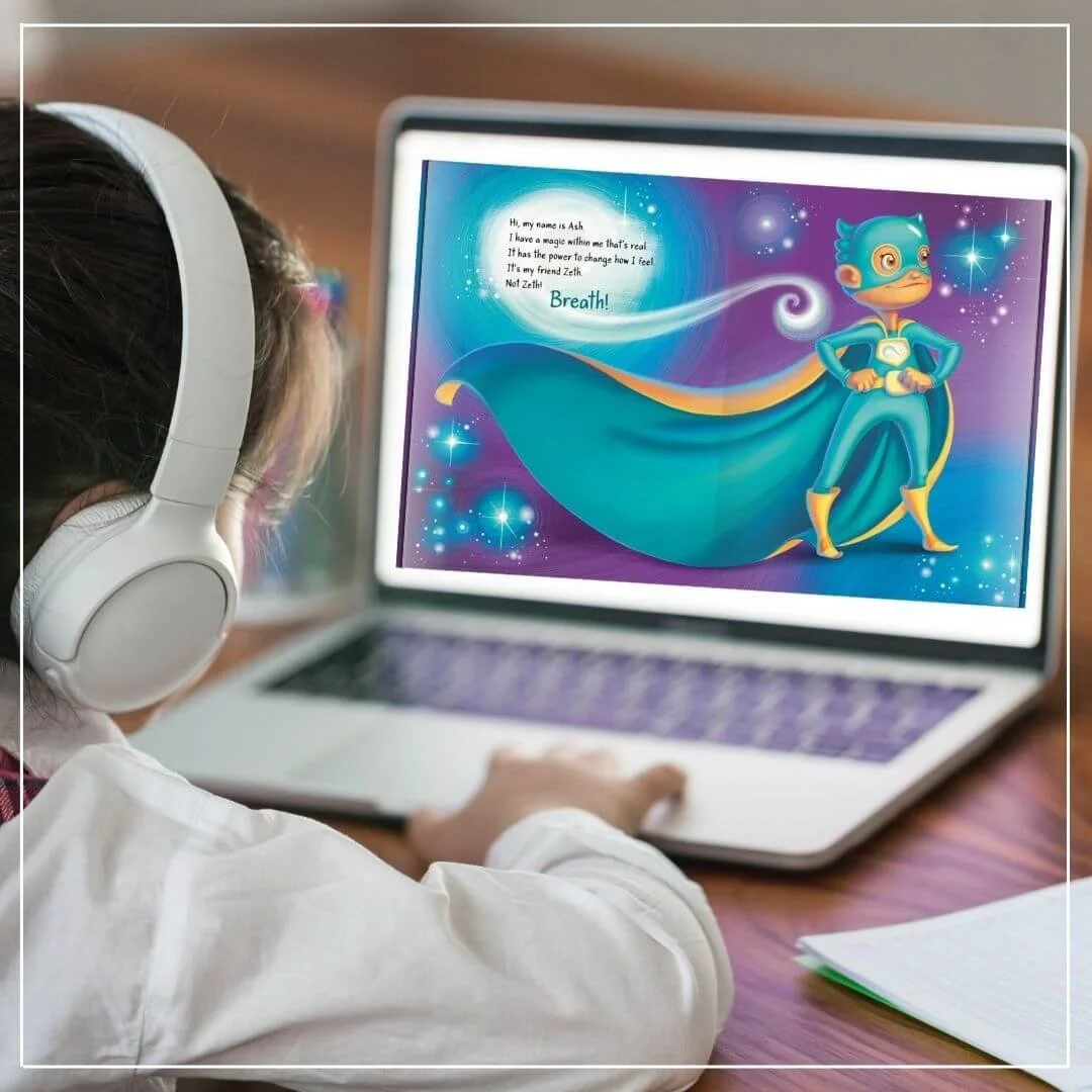 Child with headphones sitting at computer listening to the My Friend Breath audiobook to help with mindfulness and self-regulation