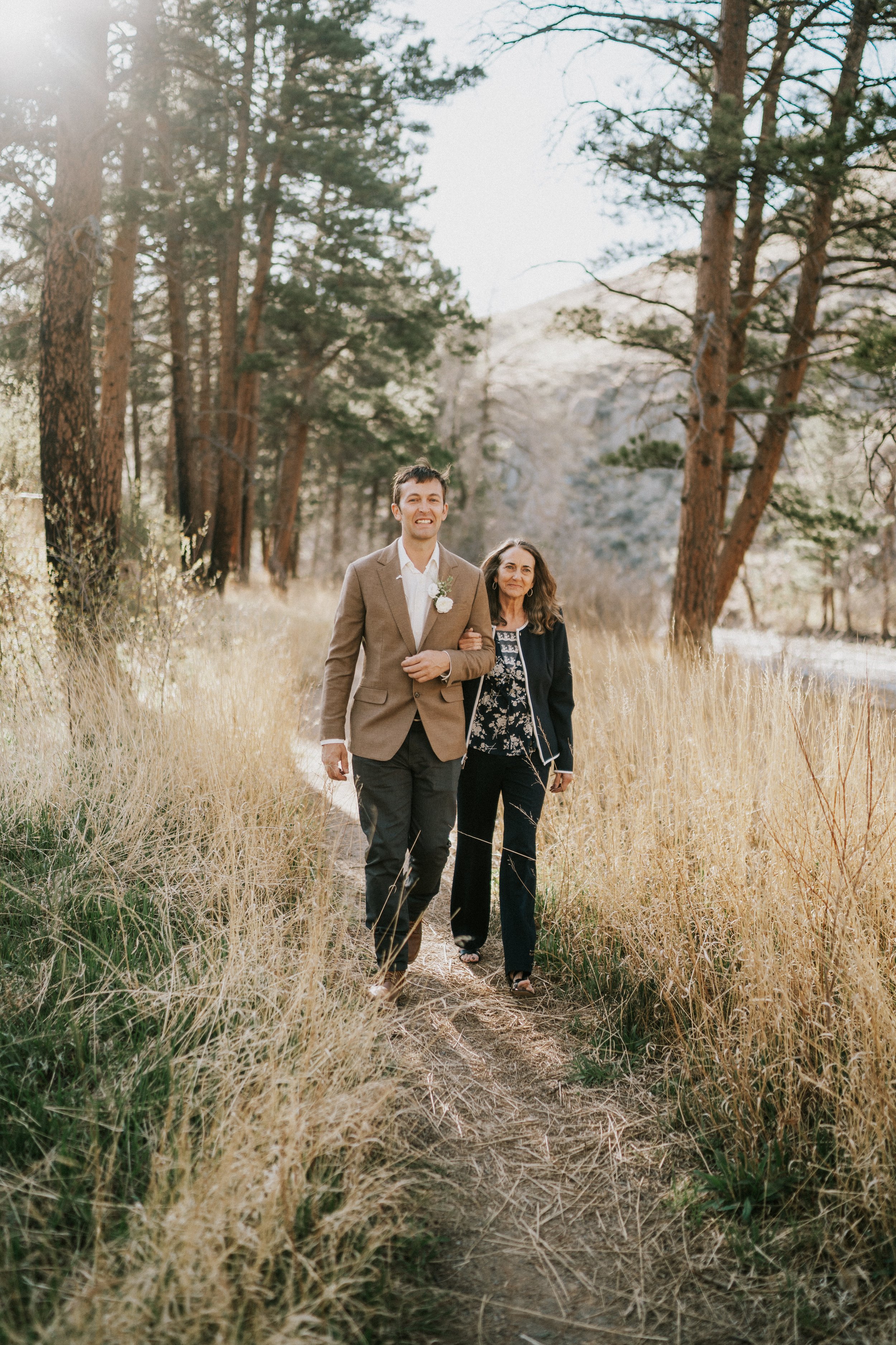 poudre-canyon-fort-collins-wedding-photographer-groom-walking-down-aisle