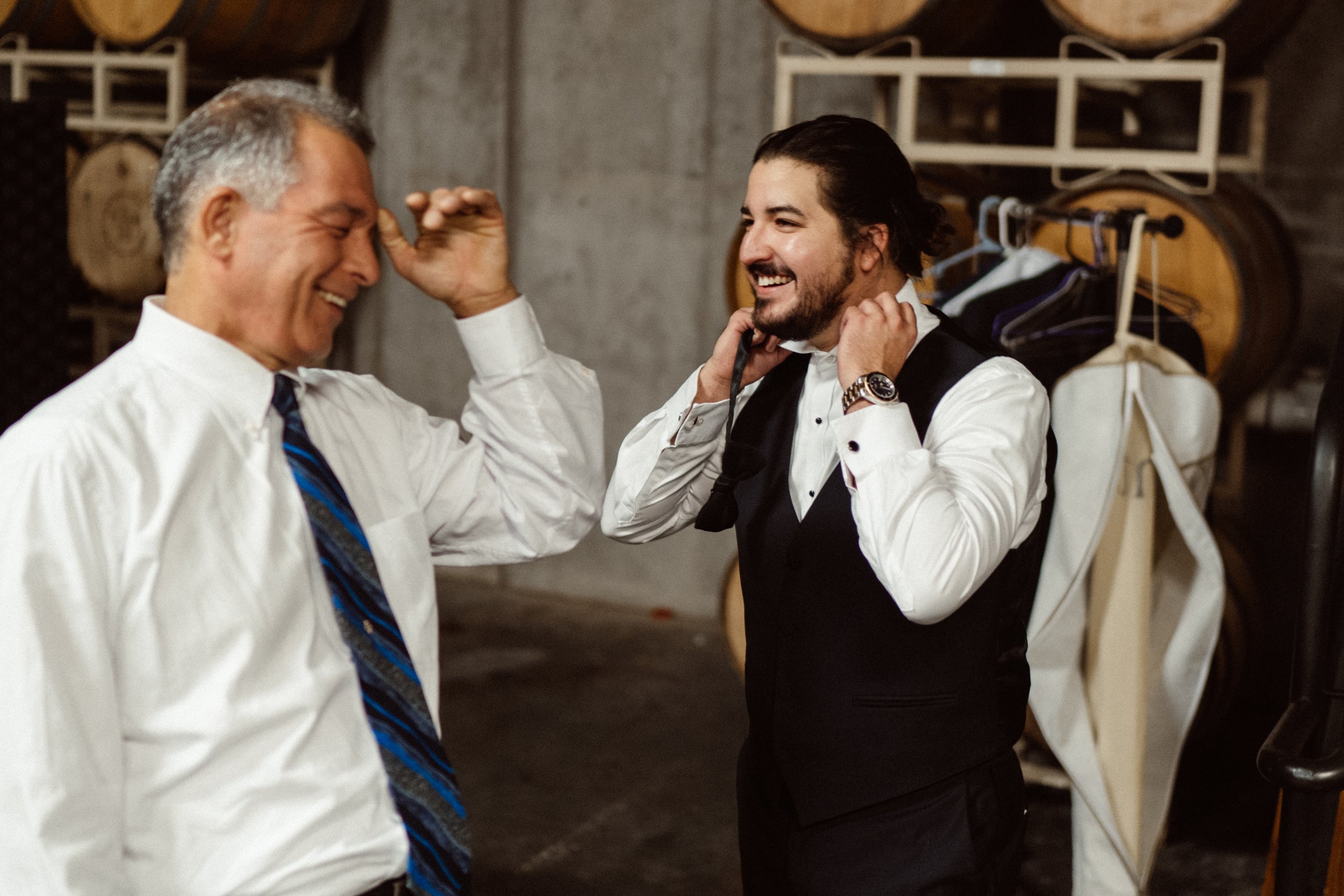 groom and father of the groom getting ready