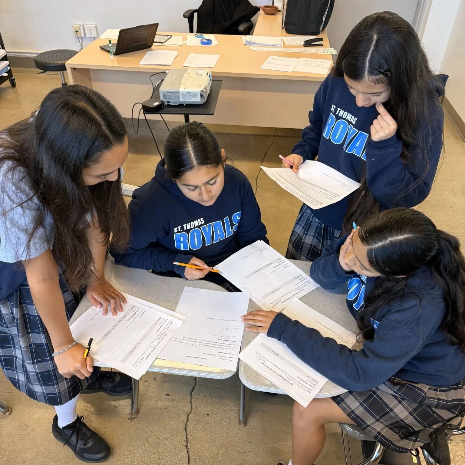 Algebra 1 Honors students at St. Thomas the Apostle completed four interactive stations focused on recognizing and creating equivalent equations through algebraic transformations. They showcased clear step-by-step reasoning and applied algebraic prop