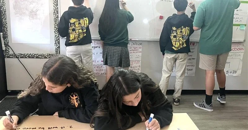 Algebra 1 Honors students at St. Cyprian are learning to apply algebraic concepts in a real-world context by planning a party. They worked collaboratively, developed detailed plans, and wrote algebraic expressions to represent their ideas. Director P