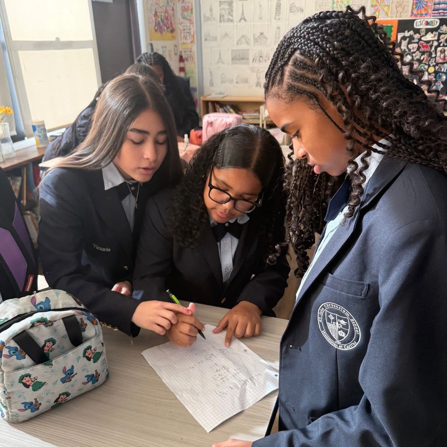 Algebra 1 Honors students at St. John Chrysostom reviewed key skills for the High School Placement Test (HSPT). Students have been taking ownership over their learning by bringing in questions to go over as a class. They review test taking strategies