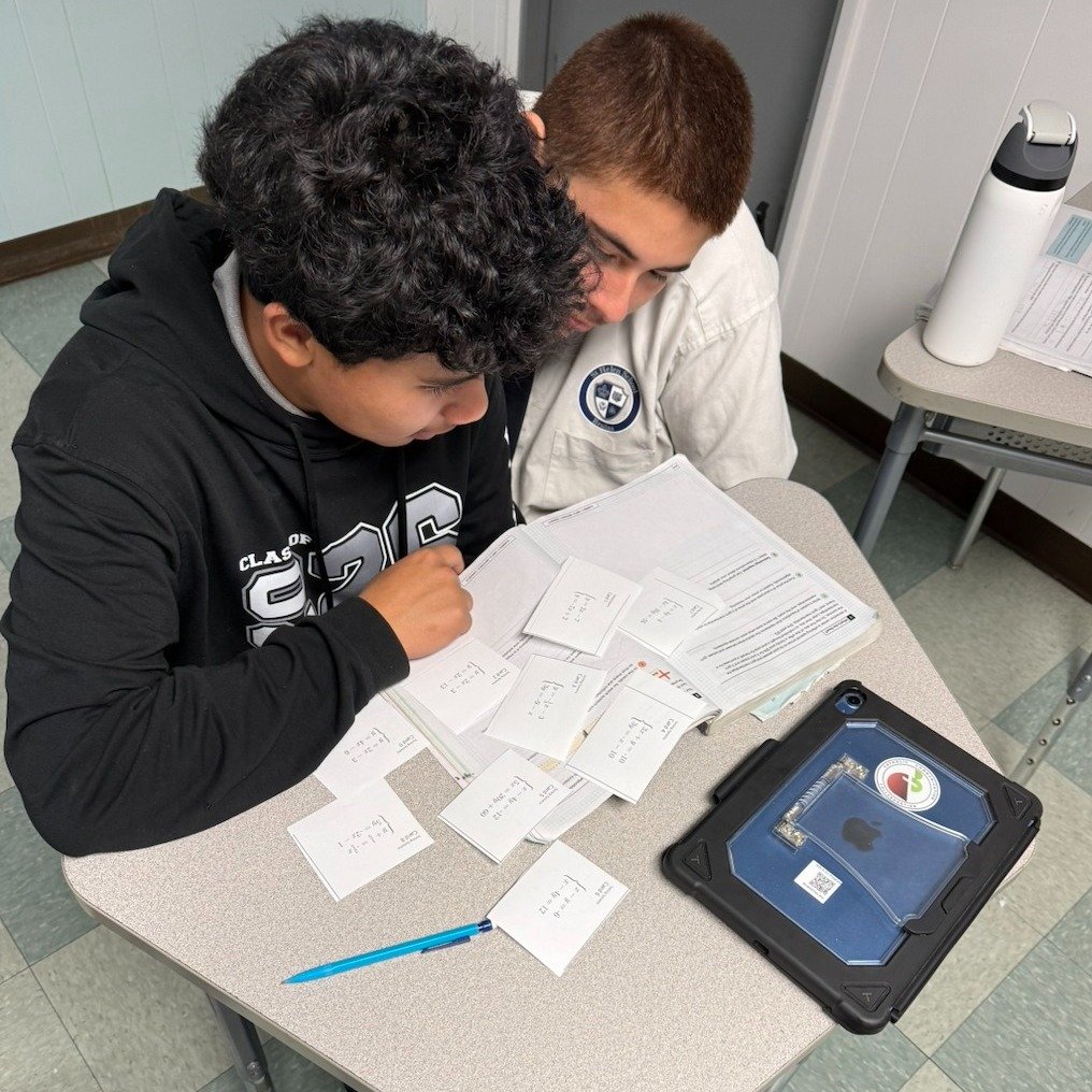 Algebra 1 Honors students at St. Helen worked in groups to categorize systems of equations. Students were given 9 cards to solve, discuss, and sort into categories based on the number of solutions. Director Yanez will be will be launching the 2026 Su