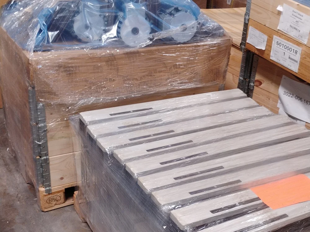 Crated new Schabmüller forklift drive wheels on EPAL pallets