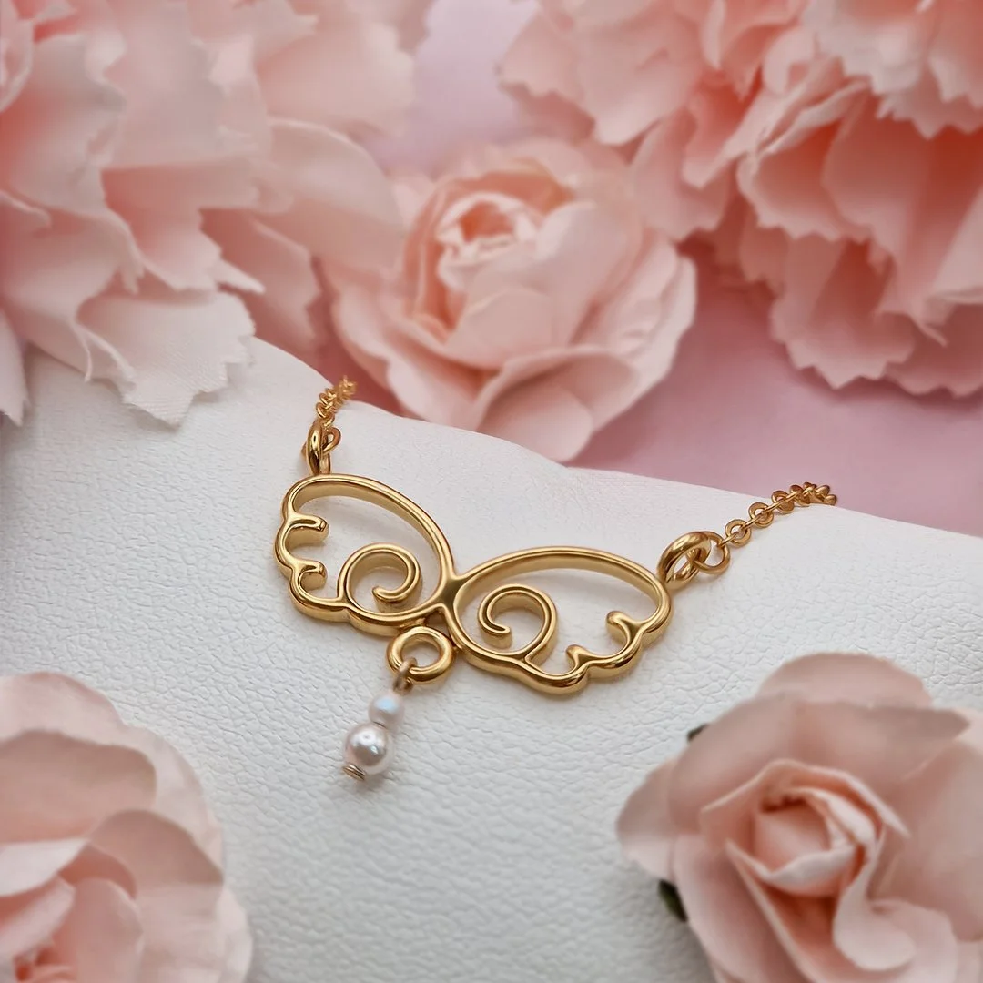 Gold Pearl Angelic Wing Necklace Square.jpg