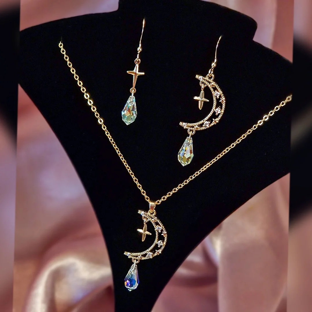 Asymemetric Moon and Star Hook Earrings Square.jpg