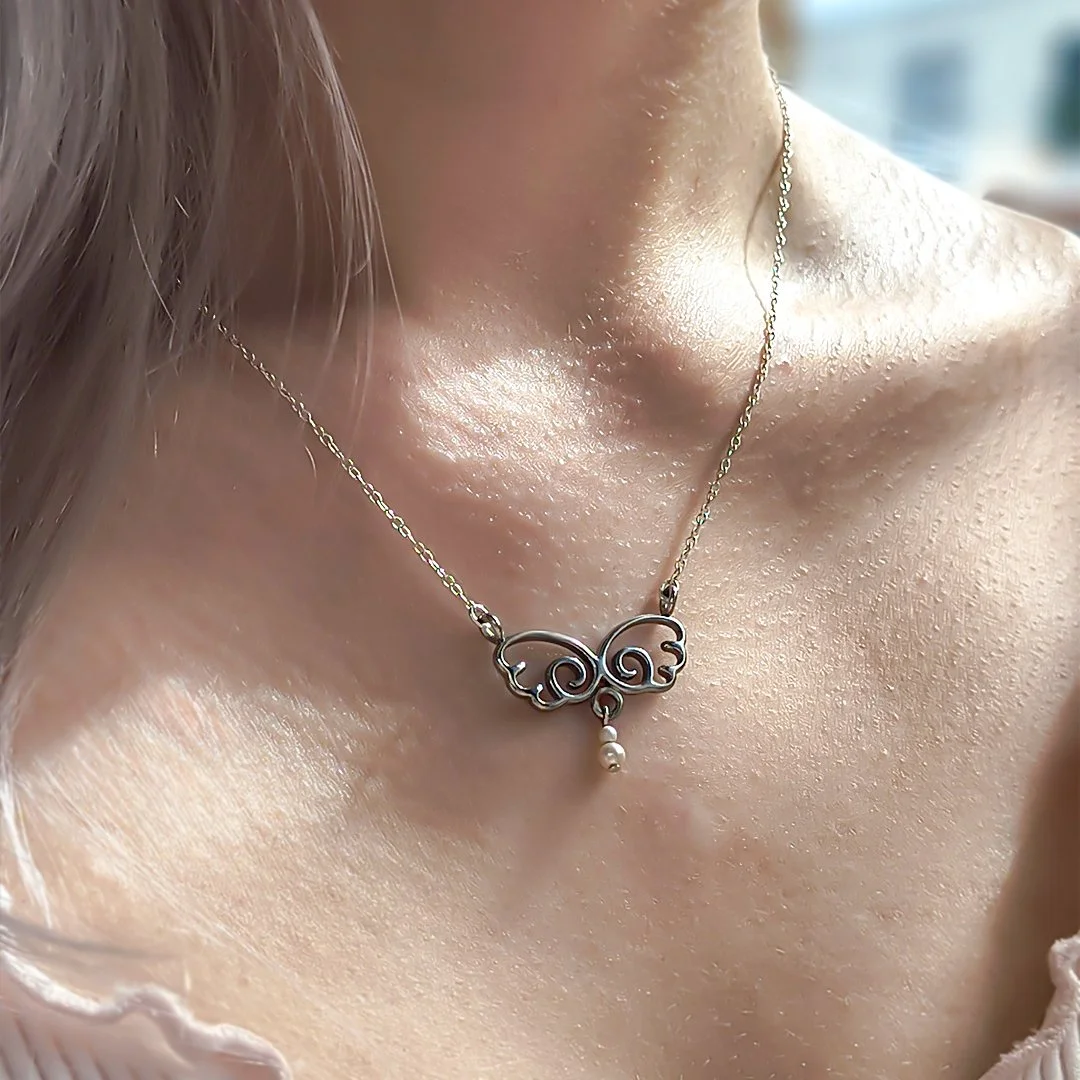 Angelic Wing Necklace Silver Pearl Square Close Model.jpg