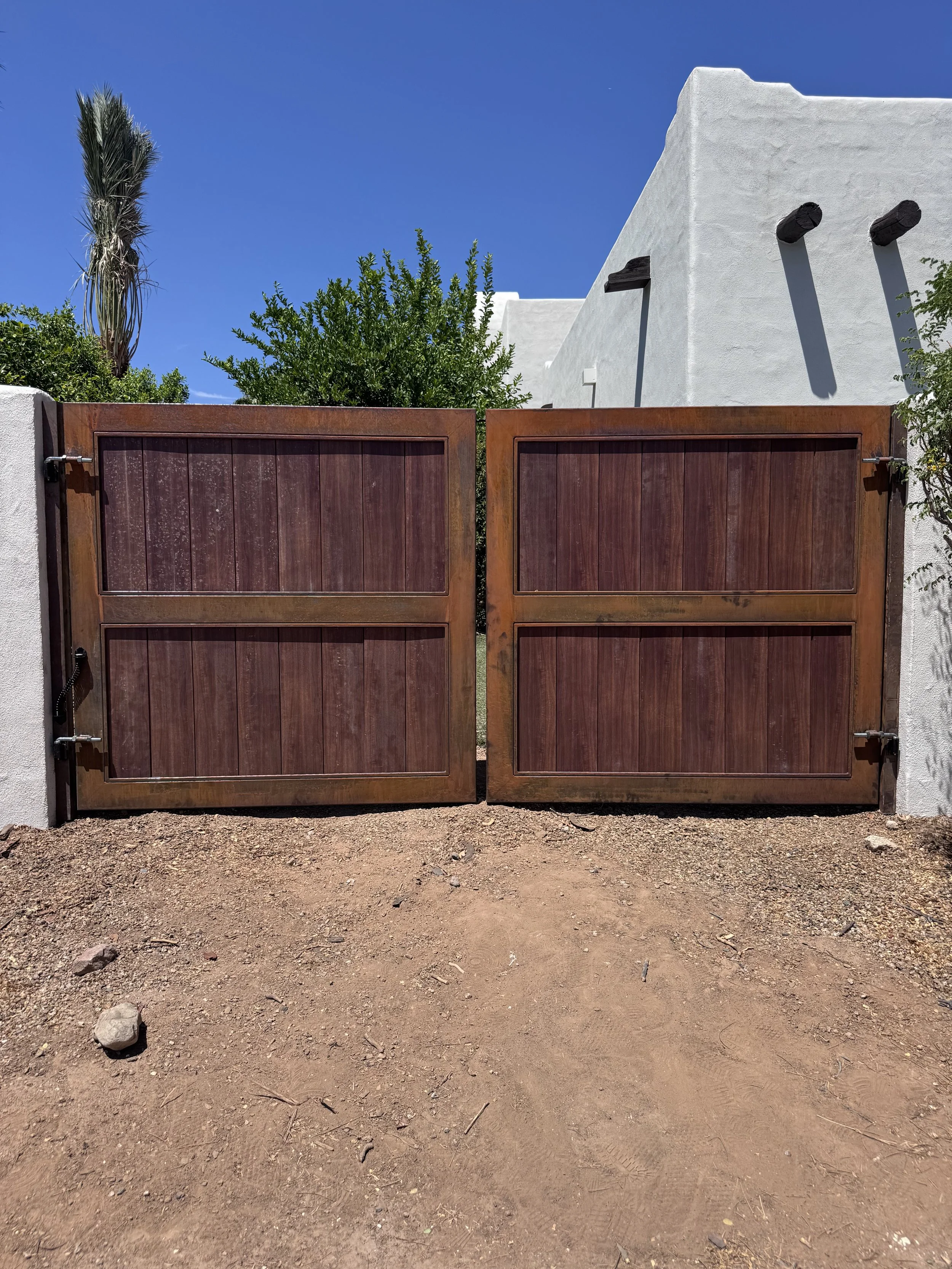 Custom wood and steel double driveway gate