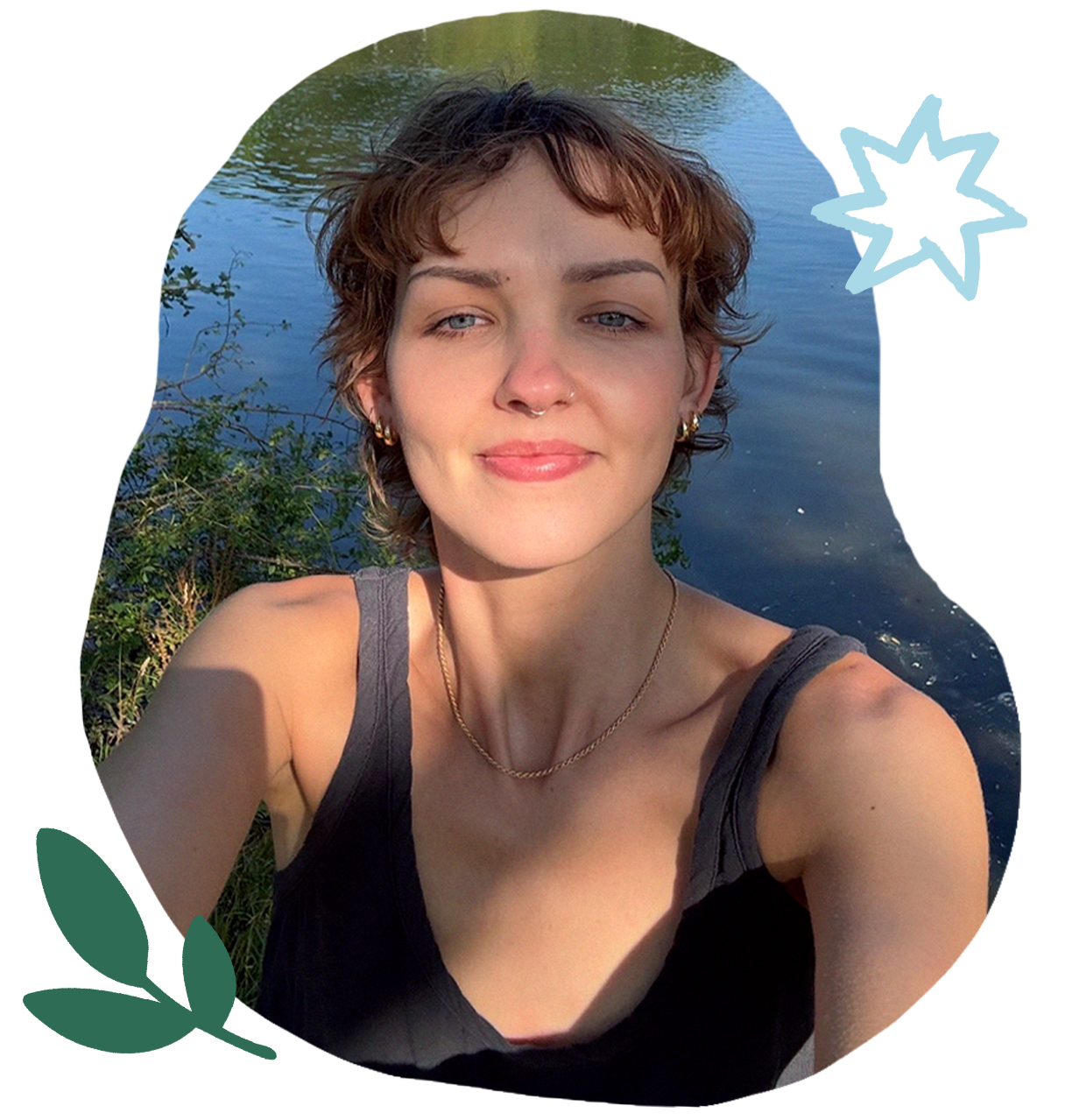 Portrait of Gosia Grodzka, illustrator and tarot reader, photographed outdoors.