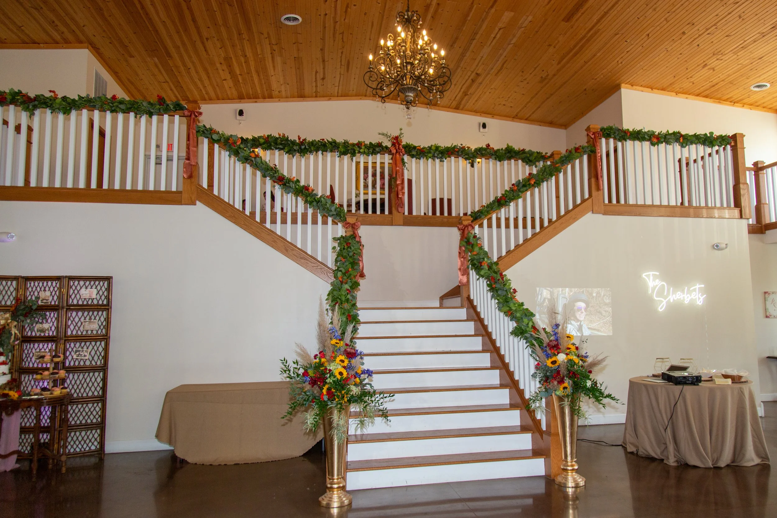 This is a scenic boho elegant rustic view of the inside of the award-winning reception hall outdoor mansion wedding venue Rosewood Manor in Miamisburg at Magnolia Estate. Surrounded by the Greater Dayton, Columbus, and Cincinnati areas. 